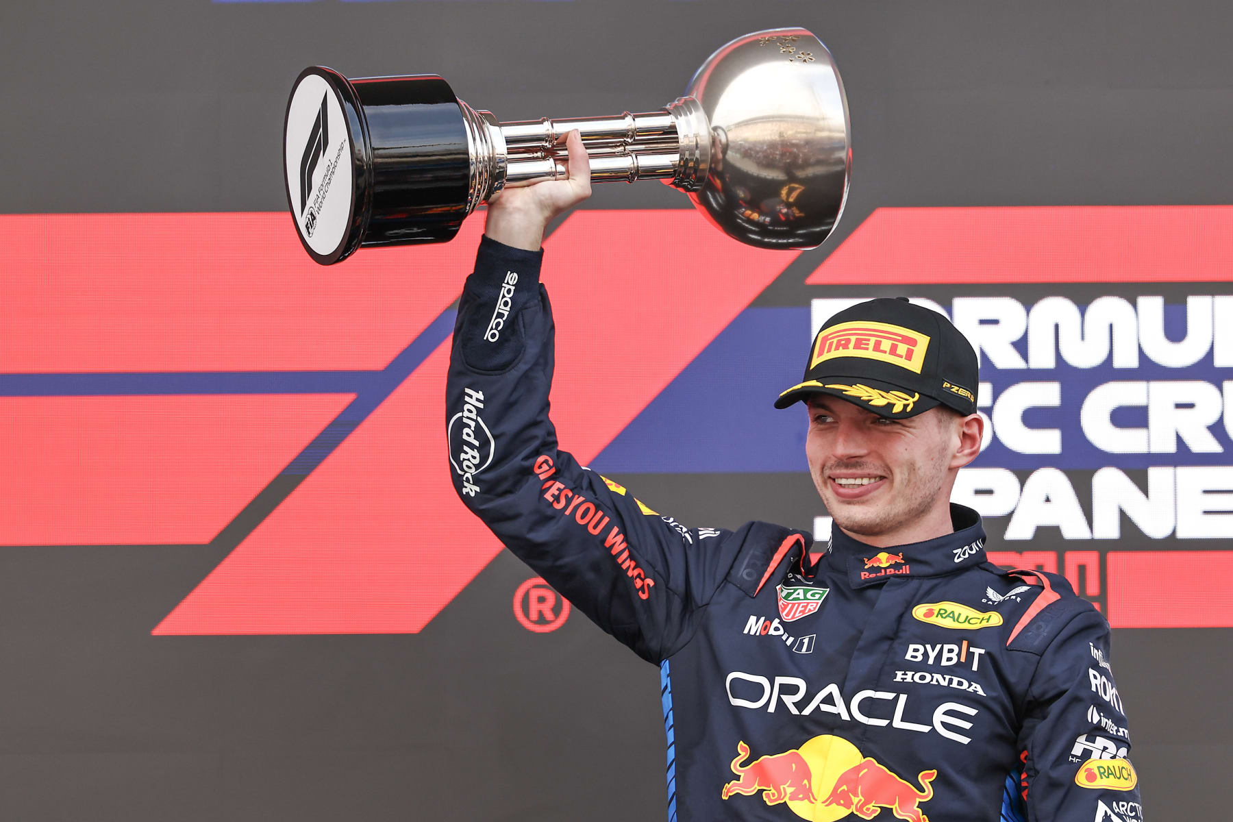 SUZUKA, JAPAN - APRIL 7: Max Verstappen of the Netherlands and Oracle Red Bull Racing celebrates his win on the podium during the F1 Grand Prix of Japan at Suzuka International Racing Course on April 7, 2024 in Suzuka, Japan. (Photo by Song Haiyuan/MB Media/Getty Images)