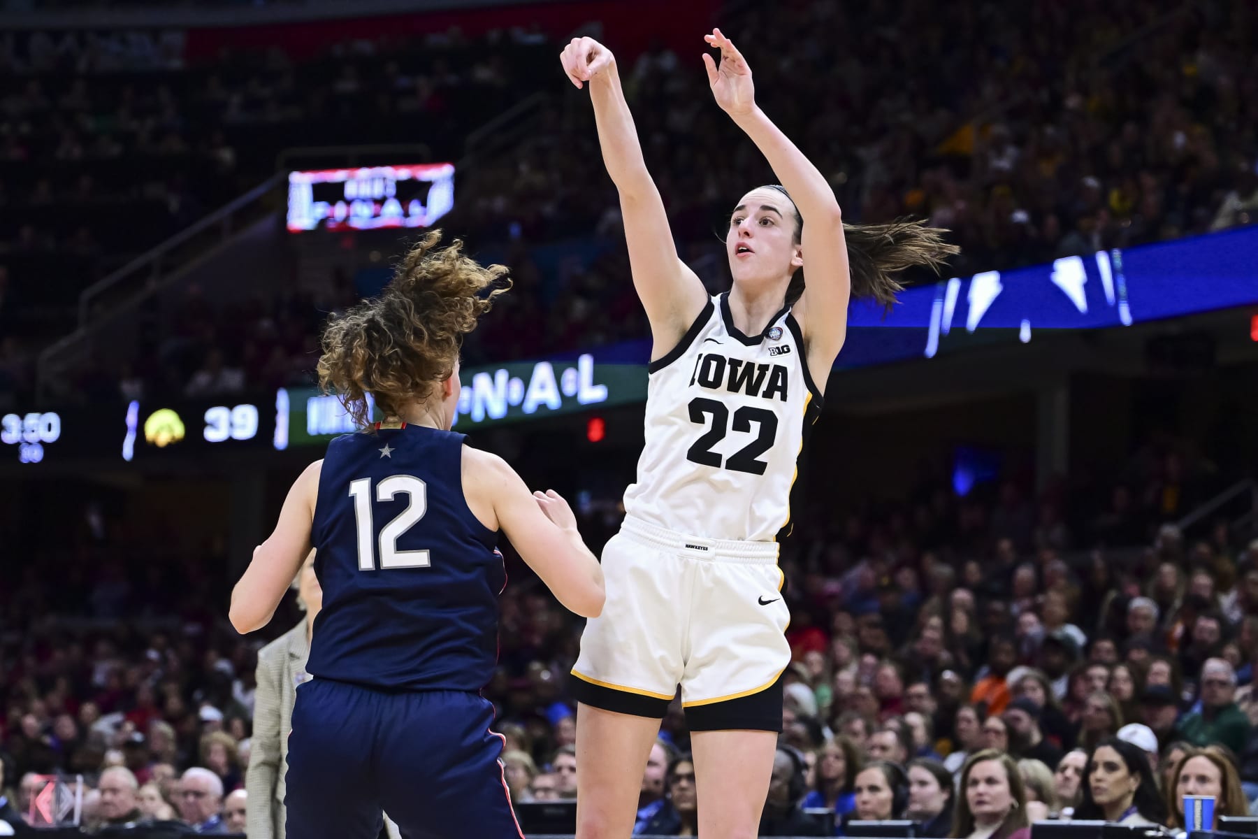 CLEVELAND, OHIO - APRIL 5: Caitlin Clark #22 of the Iowa Hawkeyes shoots against the UConn Huskies during the NCAA Women's Basketball Tournament Final Four semifinal game at Rocket Mortgage Fieldhouse on April 5, 2024 in Cleveland, Ohio. (Photo by Ben Solomon/NCAA Photos via Getty Images)