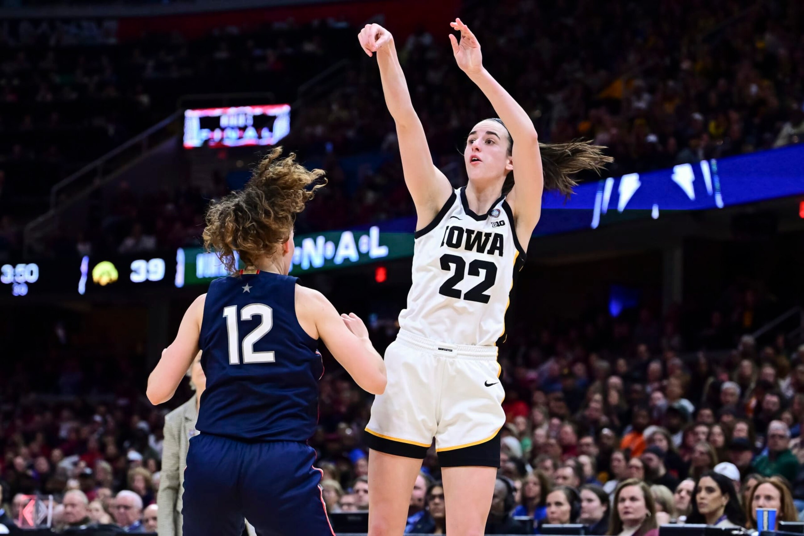 CLEVELAND, OHIO - APRIL 5: Caitlin Clark #22 of the Iowa Hawkeyes shoots against the UConn Huskies during the NCAA Women's Basketball Tournament Final Four semifinal game at Rocket Mortgage Fieldhouse on April 5, 2024 in Cleveland, Ohio. (Photo by Ben Solomon/NCAA Photos via Getty Images) CLEVELAND, OHIO - APRIL 5: Caitlin Clark #22 of the Iowa Hawkeyes shoots against the UConn Huskies during the NCAA Women's Basketball Tournament Final Four semifinal game at Rocket Mortgage Fieldhouse on April 5, 2024 in Cleveland, Ohio. (Photo by Ben Solomon/NCAA Photos via Getty Images)