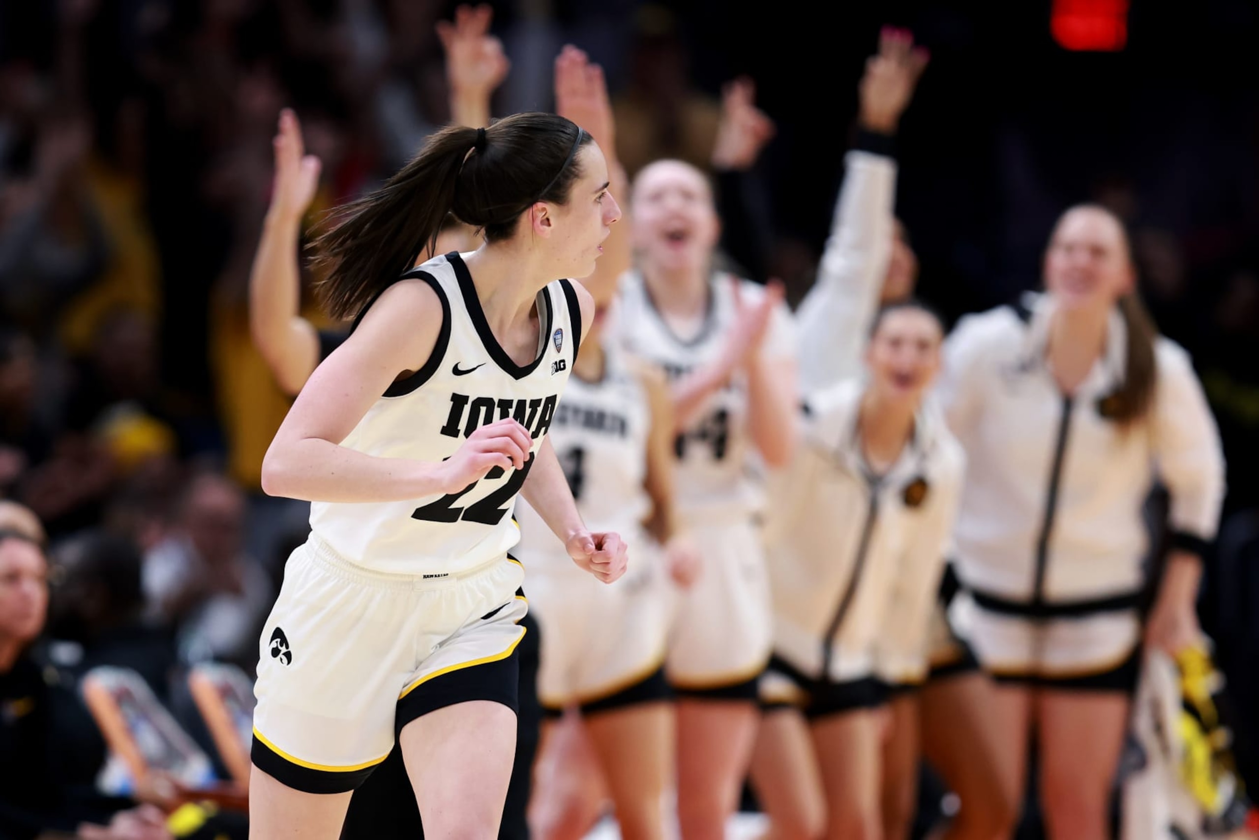 CLEVELAND, OHIO - APRIL 05: Caitlin Clark #22 of the Iowa Hawkeyes reacts after a three point basket in the second half during the NCAA Women's Basketball Tournament Final Four semifinal game against the UConn Huskies at Rocket Mortgage Fieldhouse on April 05, 2024 in Cleveland, Ohio. (Photo by Gregory Shamus/Getty Images) CLEVELAND, OHIO - APRIL 05: Caitlin Clark #22 of the Iowa Hawkeyes reacts after a three point basket in the second half during the NCAA Women's Basketball Tournament Final Four semifinal game against the UConn Huskies at Rocket Mortgage Fieldhouse on April 05, 2024 in Cleveland, Ohio. (Photo by Gregory Shamus/Getty Images)