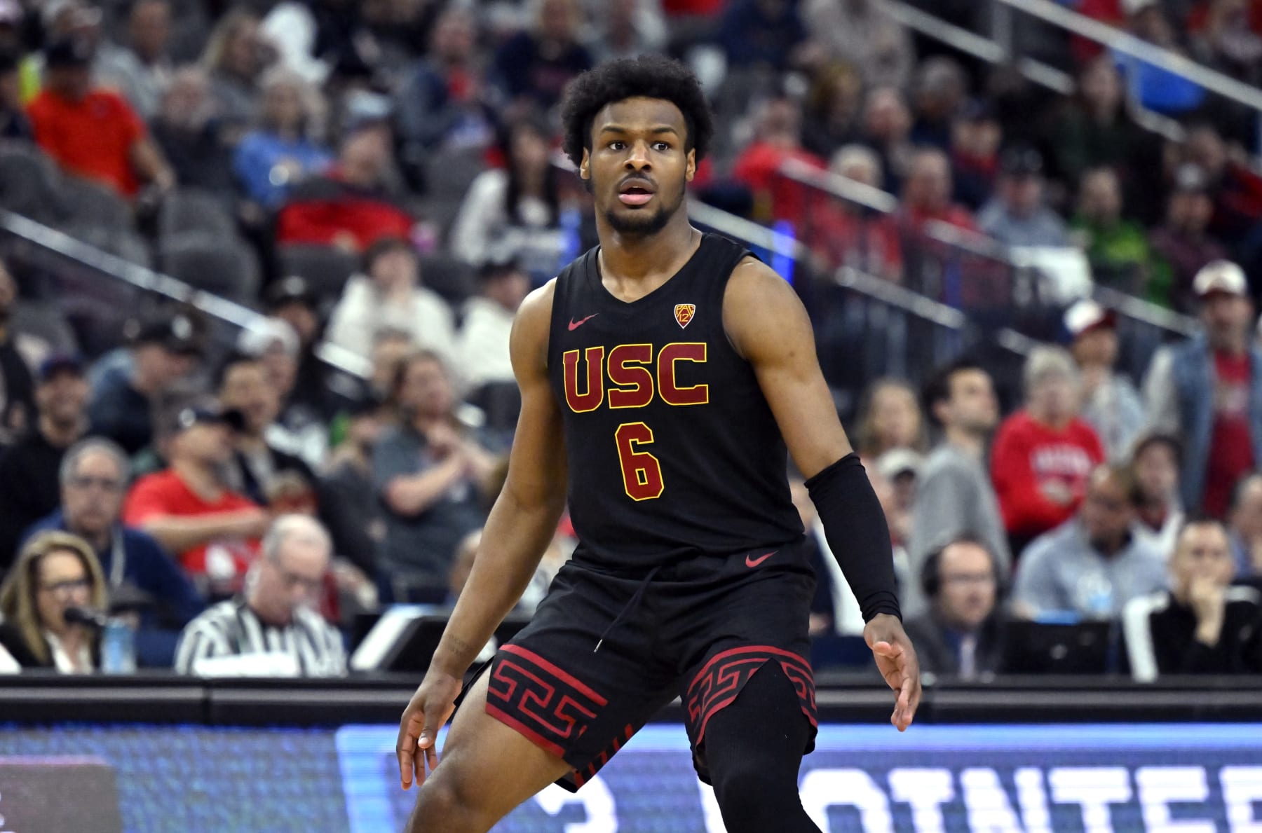 LAS VEGAS, NEVADA - MARCH 14: Bronny James #6 of the USC Trojans looks on in the second half of a quarterfinal game against the Arizona Wildcats during the Pac-12 Conference basketball tournament at T-Mobile Arena on March 14, 2024 in Las Vegas, Nevada. The Wildcats defeated the Trojans 70-49. (Photo by David Becker/Getty Images)