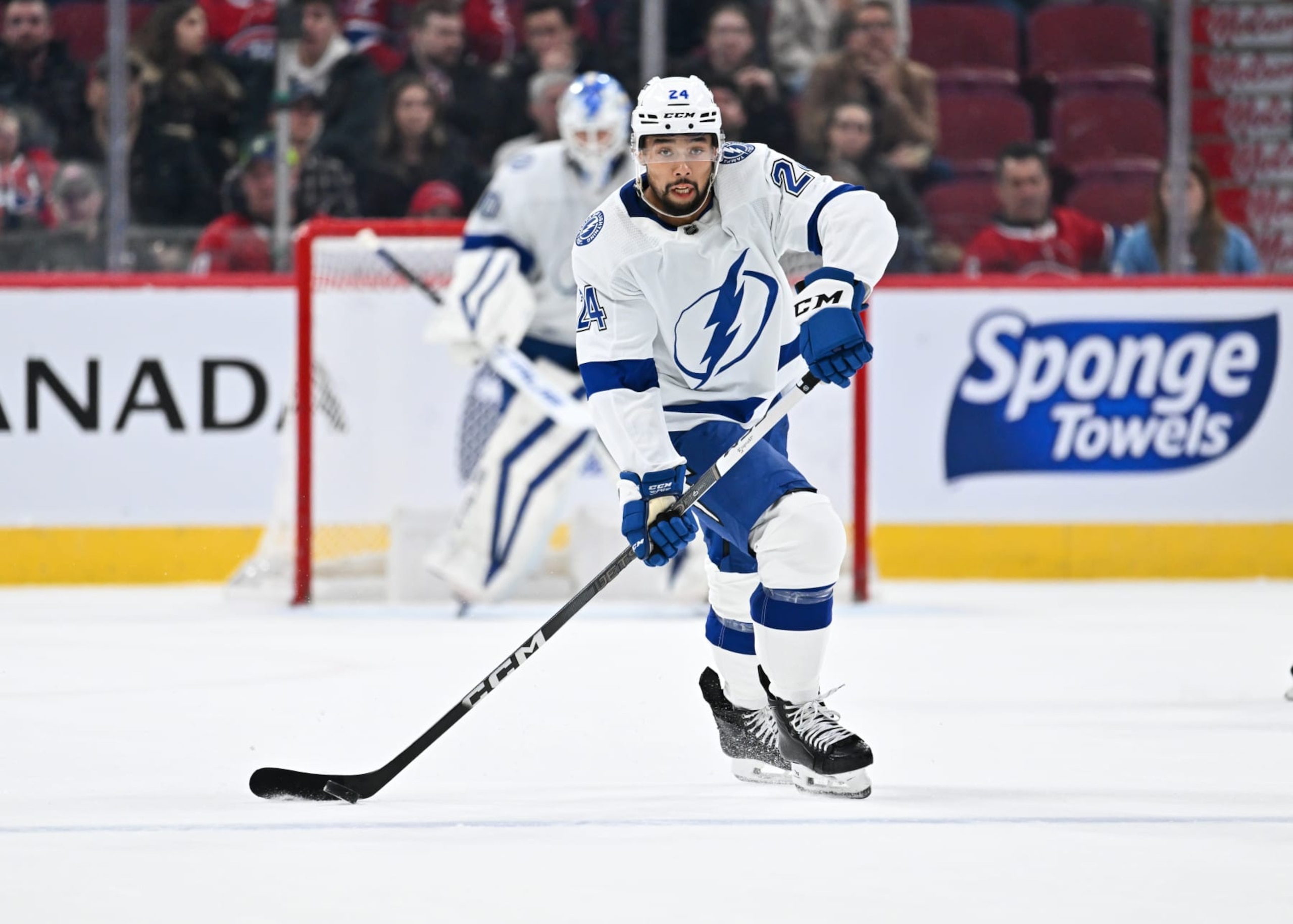 MONTREAL, CANADA - APRIL 04:  Matt Dumba #24 of the Tampa Bay Lightning skates the puck during the first period against the Montreal Canadiens at the Bell Centre on April 4, 2024 in Montreal, Quebec, Canada.  The Tampa Bay Lightning defeated the Montreal Canadiens 7-4.  (Photo by Minas Panagiotakis/Getty Images)