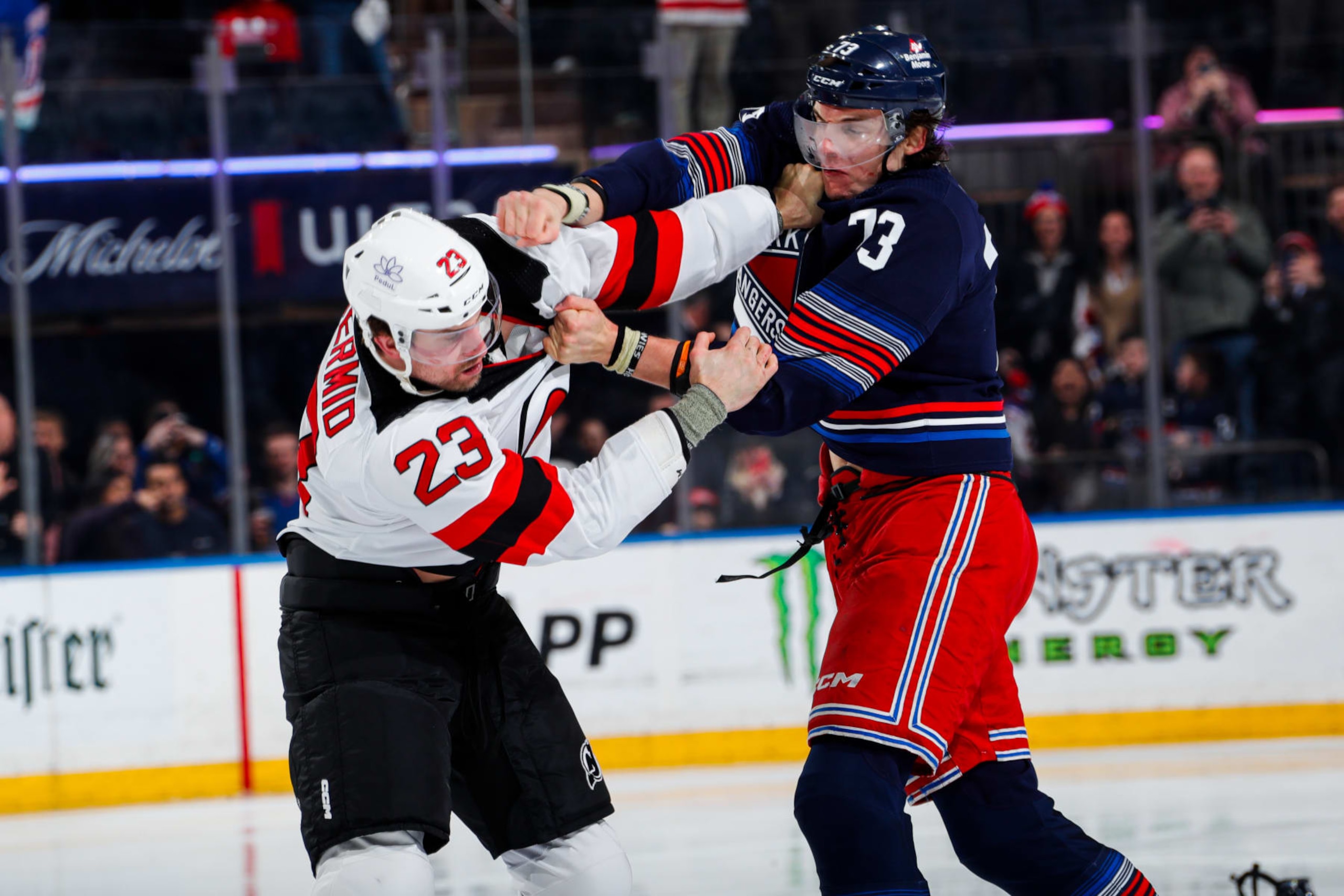 NEW YORK, NEW YORK - APRIL 03:  Matt Rempe #73 of the New York Rangers fights Kurtis MacDermid #23 of the New Jersey Devils at Madison Square Garden on April 3, 2024 in New York City. (Photo by Jared Silber/NHLI via Getty Images)