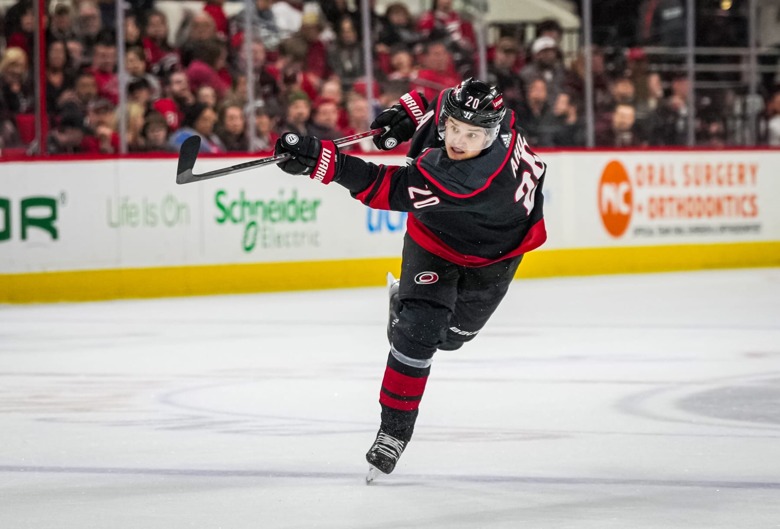 RALEIGH, NORTH CAROLINA - APRIL 07:  Sebastian Aho #20 of the Carolina Hurricanes shoots the puck during the first period against the Columbus Blue Jackets at PNC Arena on April 7, 2024 in Raleigh, North Carolina. (Photo by Josh Lavallee/NHLI via Getty Images)