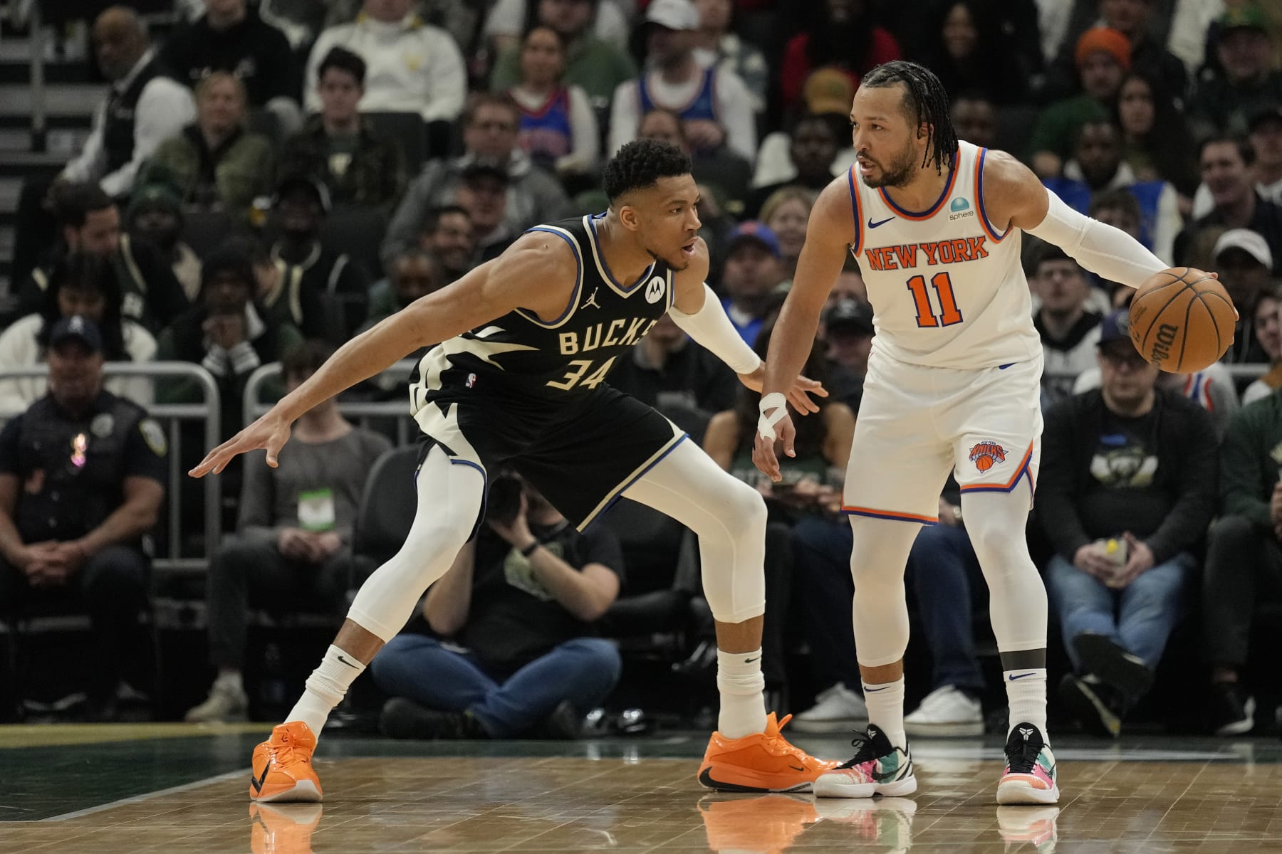 MILWAUKEE, WISCONSIN - APRIL 07: Jalen Brunson #11 of the New York Knicks dribbles the ball against Giannis Antetokounmpo #34 of the Milwaukee Bucks during the first half at Fiserv Forum on April 07, 2024 in Milwaukee, Wisconsin. NOTE TO USER: User expressly acknowledges and agrees that, by downloading and or using this photograph, User is consenting to the terms and conditions of the Getty Images License Agreement. (Photo by Patrick McDermott/Getty Images)