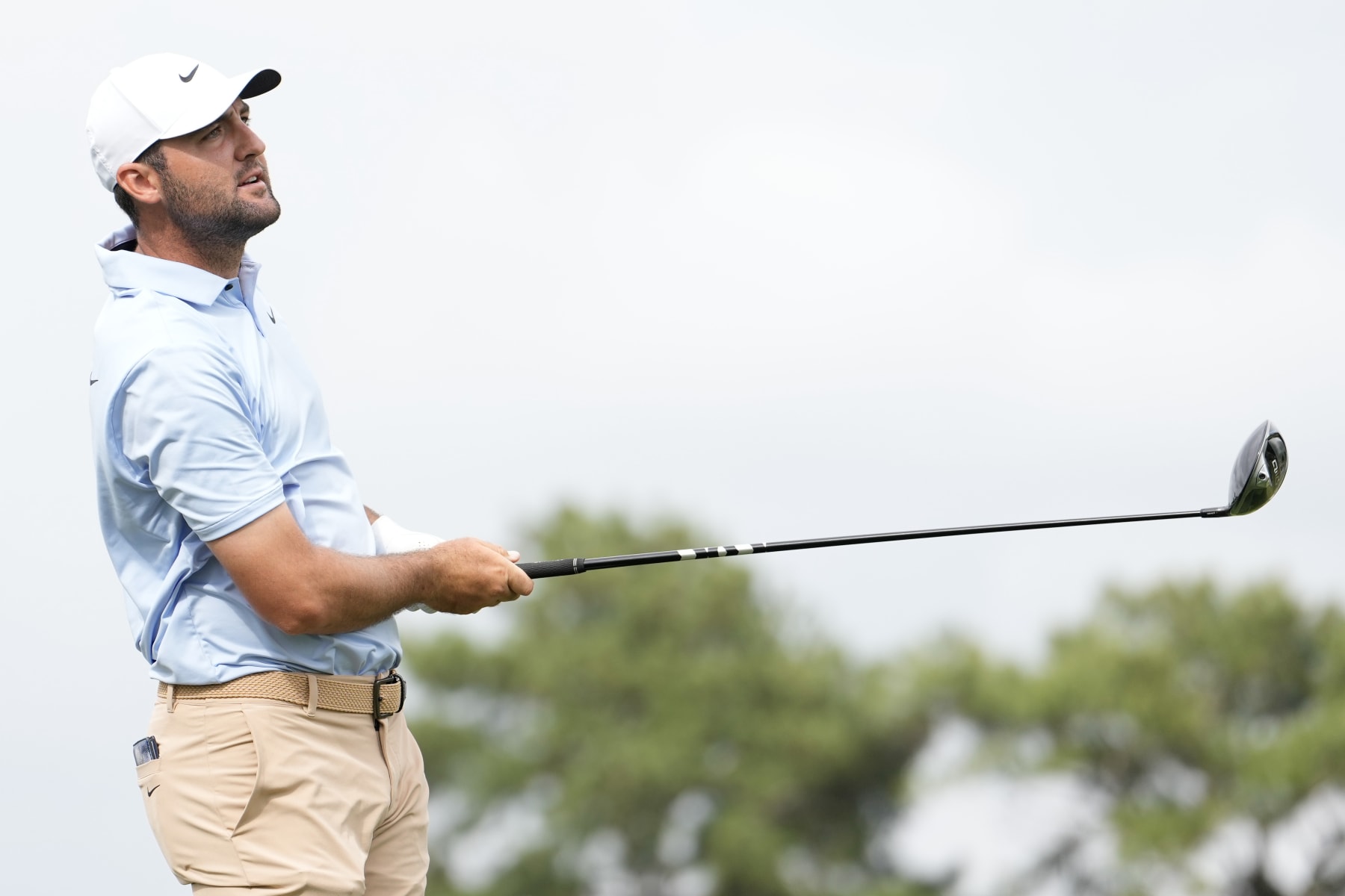 HOUSTON, TEXAS - MARCH 31: Scottie Scheffler of the United States hits a tee shot on the 17th hole during the final round of the Texas Children's Houston Open at Memorial Park Golf Course on March 31, 2024 in Houston, Texas. (Photo by Raj Mehta/Getty Images)