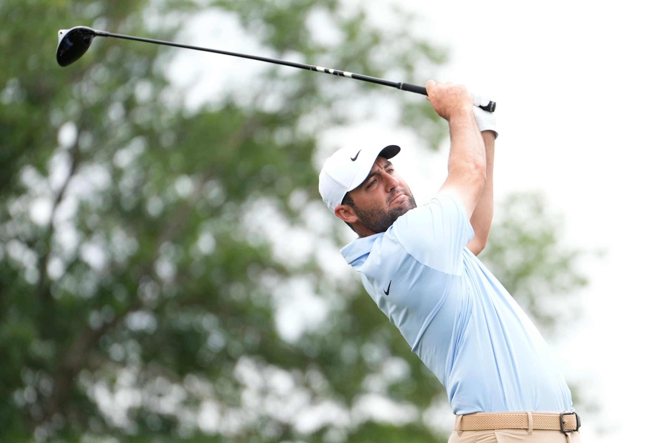 HOUSTON, TEXAS - MARCH 31: Scottie Scheffler of the United States hits a tee shot on the first hole during the final round of the Texas Children's Houston Open at Memorial Park Golf Course on March 31, 2024 in Houston, Texas. (Photo by Raj Mehta/Getty Images)