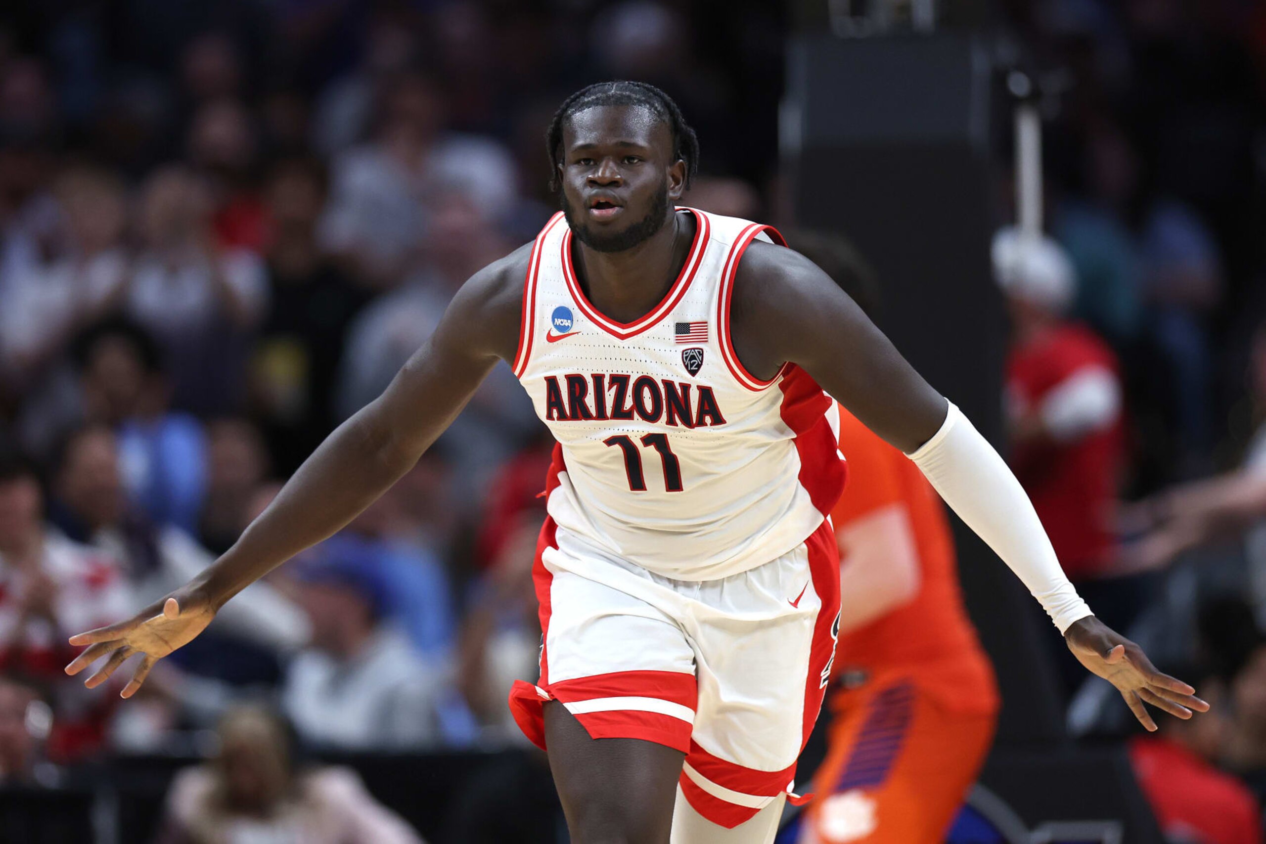 LOS ANGELES, CALIFORNIA - MARCH 28: Oumar Ballo #11 of the Arizona Wildcats celebrates in a game against the Clemson Tigers during the second half in the Sweet 16 round of the NCAA Men's Basketball Tournament at Crypto.com Arena on March 28, 2024 in Los Angeles, California. (Photo by Harry How/Getty Images) LOS ANGELES, CALIFORNIA - MARCH 28: Oumar Ballo #11 of the Arizona Wildcats celebrates in a game against the Clemson Tigers during the second half in the Sweet 16 round of the NCAA Men's Basketball Tournament at Crypto.com Arena on March 28, 2024 in Los Angeles, California. (Photo by Harry How/Getty Images)