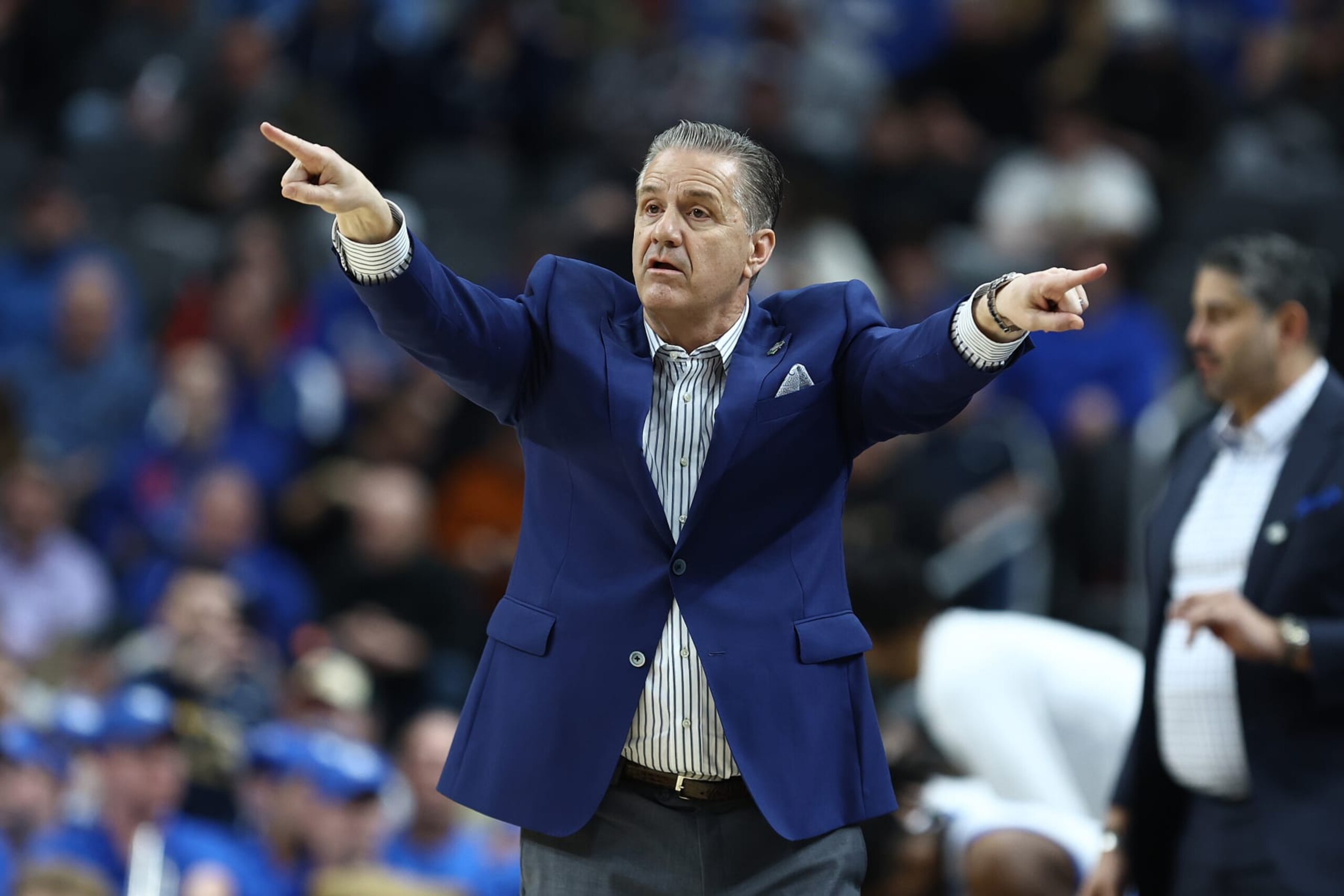 PITTSBURGH, PENNSYLVANIA - MARCH 21: Head coach John Calipari of the Kentucky Wildcats reacts during the first half of a game against the Oakland Golden Grizzlies in the first round of the NCAA Men's Basketball Tournament at PPG PAINTS Arena on March 21, 2024 in Pittsburgh, Pennsylvania. (Photo by Tim Nwachukwu/Getty Images) PITTSBURGH, PENNSYLVANIA - MARCH 21: Head coach John Calipari of the Kentucky Wildcats reacts during the first half of a game against the Oakland Golden Grizzlies in the first round of the NCAA Men's Basketball Tournament at PPG PAINTS Arena on March 21, 2024 in Pittsburgh, Pennsylvania. (Photo by Tim Nwachukwu/Getty Images)