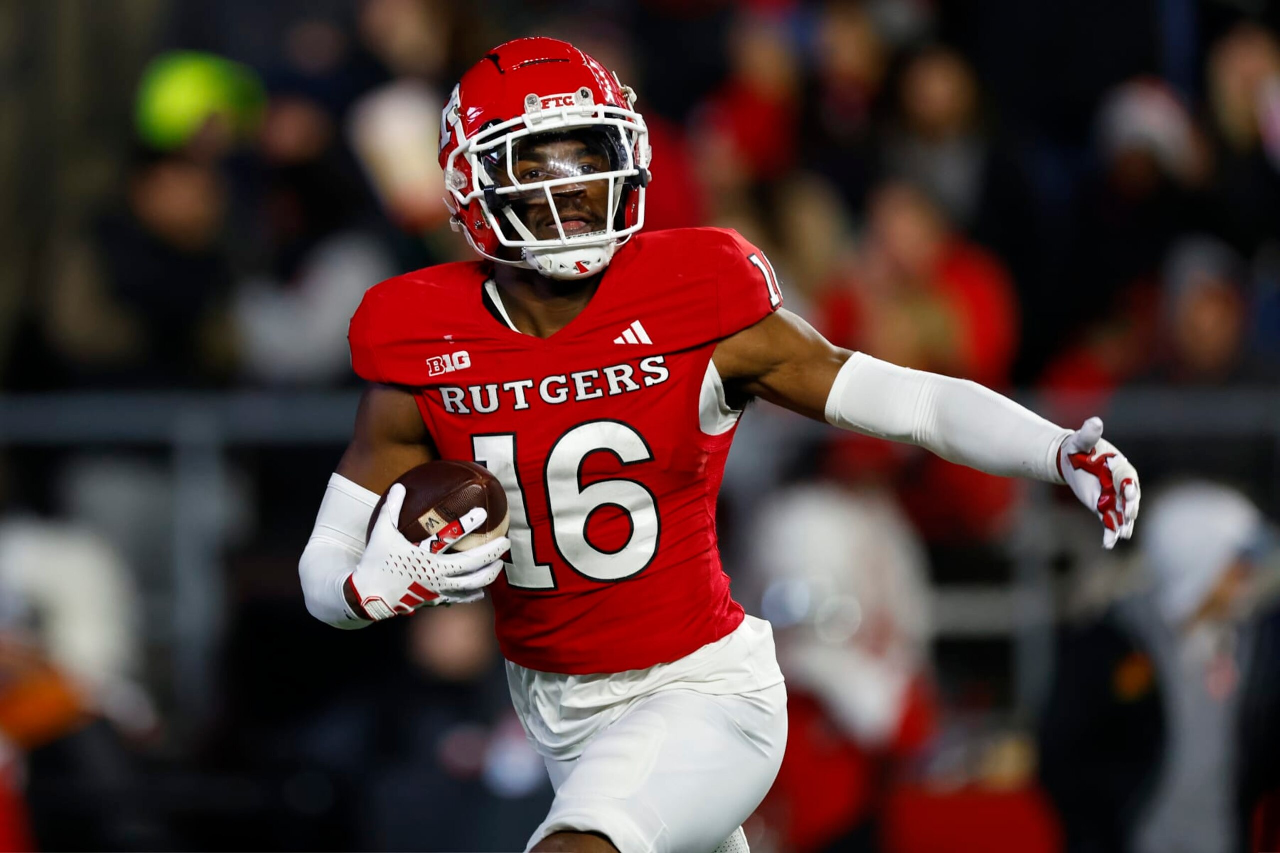 PISCATAWAY, NEW JERSEY - NOVEMBER 25: Defensive back Max Melton #16 of the Rutgers Scarlet Knights celebrates his interception against the Maryland Terrapins during the second quarter of a game at SHI Stadium on November 25, 2023 in Piscataway, New Jersey. (Photo by Rich Schultz/Getty Images)
