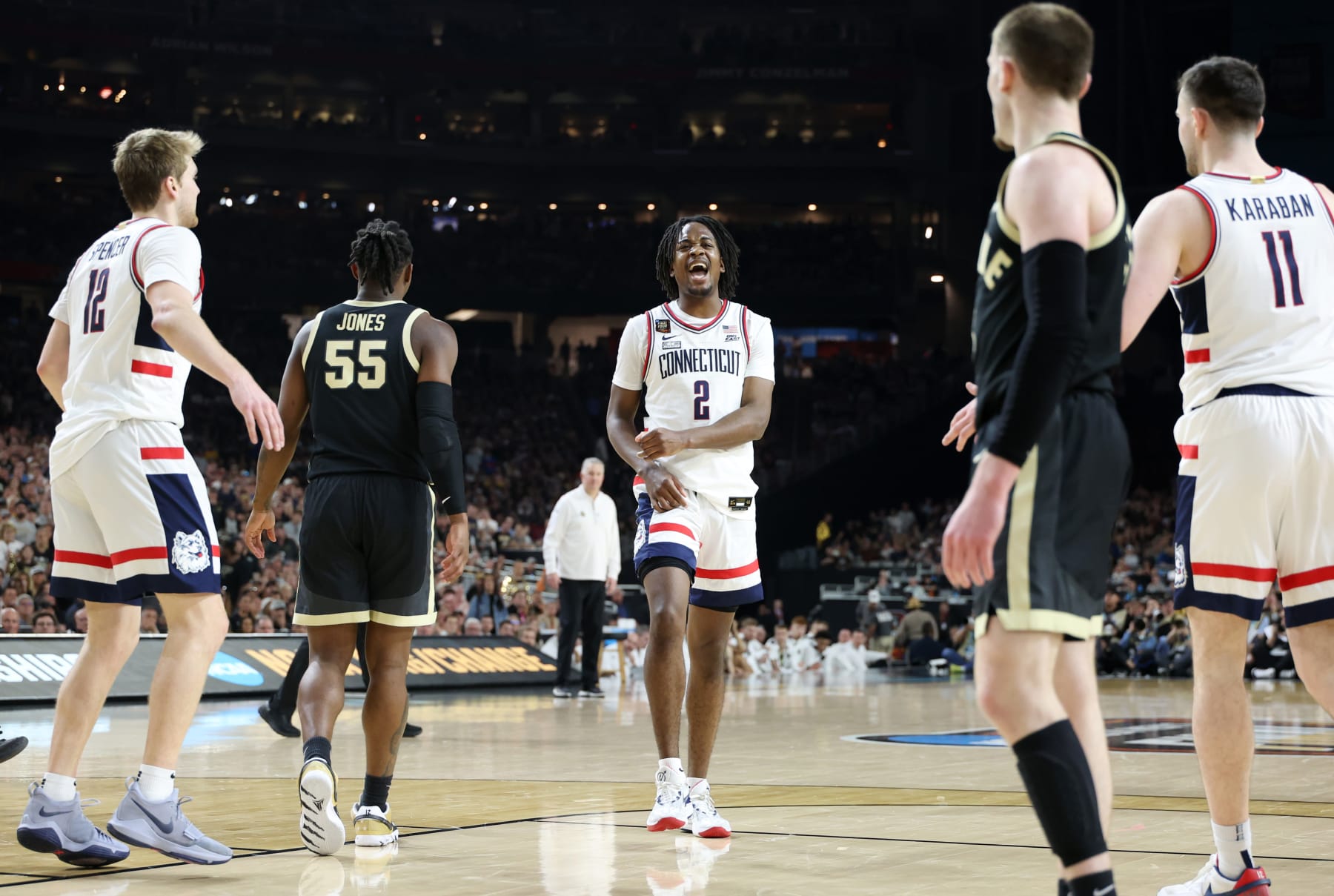 GLENDALE, ARIZONA - APRIL 08: Tristen Newton #2 of the Connecticut Huskies celebrates in the second half against the Purdue Boilermakers during the NCAA Men's Basketball Tournament National Championship game at State Farm Stadium on April 08, 2024 in Glendale, Arizona. (Photo by Christian Petersen/Getty Images)