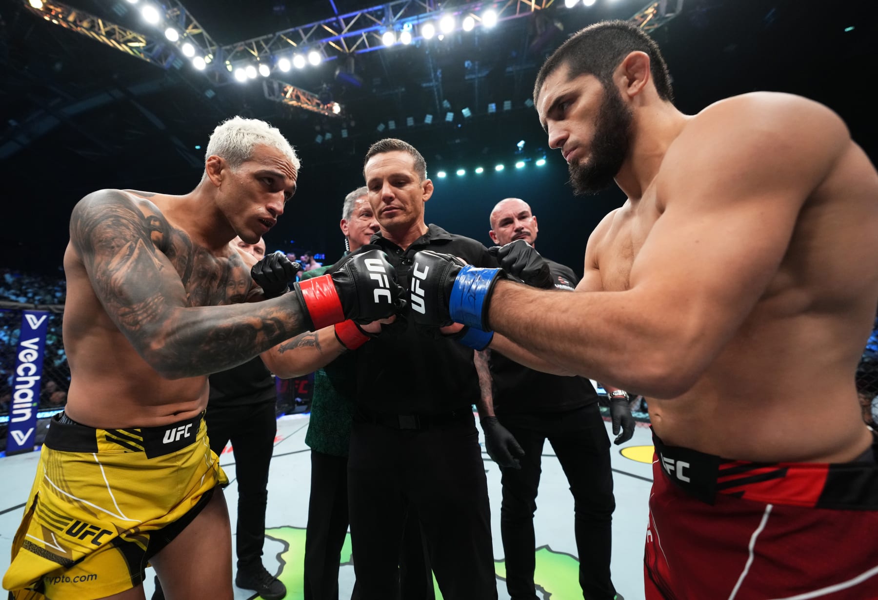 Oliveira, left, faces off with Islam Makhachev prior to their lightweight title fight at UFC 280 in 2022. 