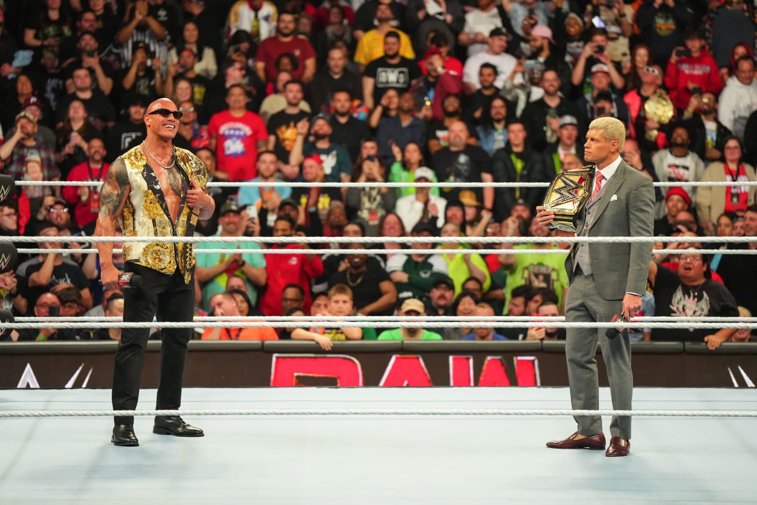 PHILADELPHIA, PENNSYLVANIA - APRIL 08: Dwayne "The Rock" Johnson stands in ring with Cody Rhodes at the Wells Fargo Center on April 8, 2024 in Philadelphia, Pennsylvania. (Photo by WWE/Getty Images) PHILADELPHIA, PENNSYLVANIA - APRIL 08: Dwayne "The Rock" Johnson stands in ring with Cody Rhodes at the Wells Fargo Center on April 8, 2024 in Philadelphia, Pennsylvania. (Photo by WWE/Getty Images)