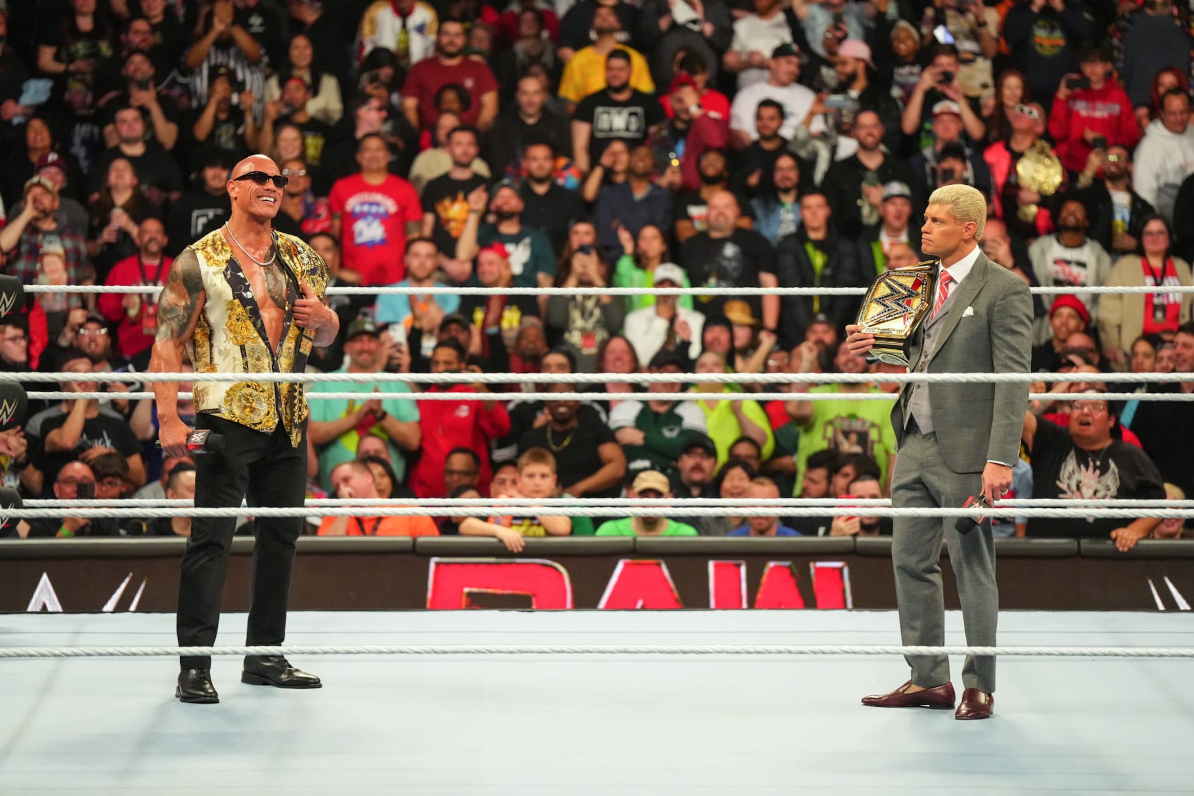 PHILADELPHIA, PENNSYLVANIA - APRIL 08: Dwayne "The Rock" Johnson stands in ring with Cody Rhodes at the Wells Fargo Center on April 8, 2024 in Philadelphia, Pennsylvania. (Photo by WWE/Getty Images) PHILADELPHIA, PENNSYLVANIA - APRIL 08: Dwayne "The Rock" Johnson stands in ring with Cody Rhodes at the Wells Fargo Center on April 8, 2024 in Philadelphia, Pennsylvania. (Photo by WWE/Getty Images)
