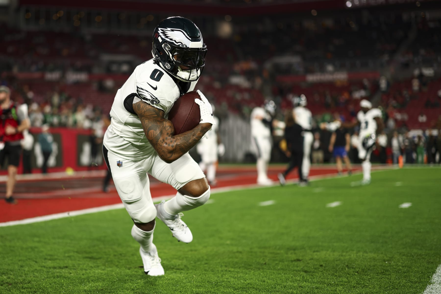 TAMPA, FL - JANUARY 15: D'Andre Swift #0 of the Philadelphia Eagles warms up prior to an NFL wild-card playoff football game against the Tampa Bay Buccaneers at Raymond James Stadium on January 15, 2024 in Tampa, Florida. (Photo by Kevin Sabitus/Getty Images)