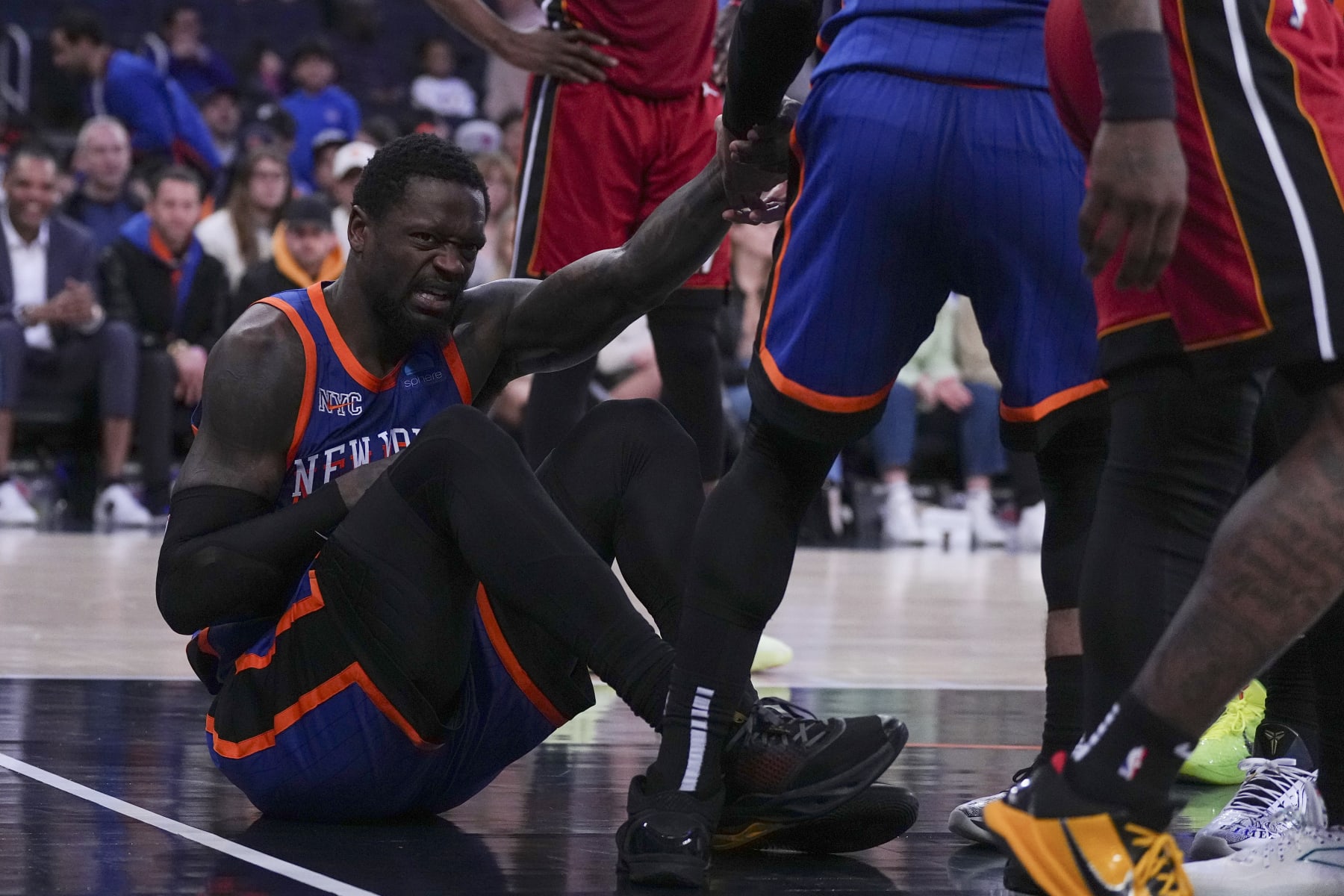 NEW YORK, NEW YORK - JANUARY 27: Julius Randle #30 of the New York Knicks reacts after an injury against the Miami Heat in the second half at Madison Square Garden on January 27, 2024 in New York City. The Knicks defeated the Heat 125-109. NOTE TO USER: User expressly acknowledges and agrees that, by downloading and or using this photograph, User is consenting to the terms and conditions of the Getty Images License Agreement. (Photo by Mitchell Leff/Getty Images)