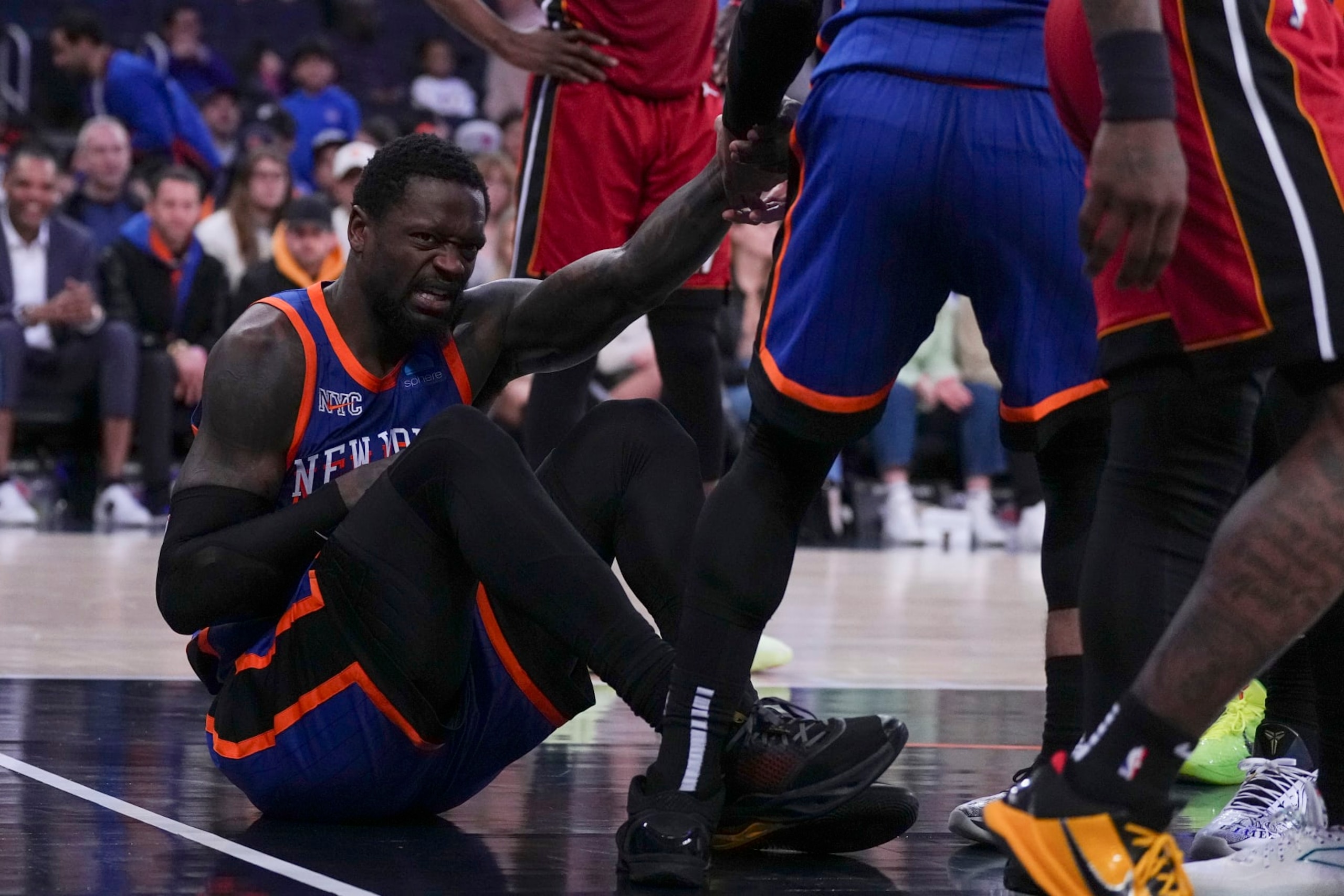 NEW YORK, NEW YORK - JANUARY 27: Julius Randle #30 of the New York Knicks reacts after an injury against the Miami Heat in the second half at Madison Square Garden on January 27, 2024 in New York City. The Knicks defeated the Heat 125-109. NOTE TO USER: User expressly acknowledges and agrees that, by downloading and or using this photograph, User is consenting to the terms and conditions of the Getty Images License Agreement. (Photo by Mitchell Leff/Getty Images) NEW YORK, NEW YORK - JANUARY 27: Julius Randle #30 of the New York Knicks reacts after an injury against the Miami Heat in the second half at Madison Square Garden on January 27, 2024 in New York City. The Knicks defeated the Heat 125-109. NOTE TO USER: User expressly acknowledges and agrees that, by downloading and or using this photograph, User is consenting to the terms and conditions of the Getty Images License Agreement. (Photo by Mitchell Leff/Getty Images)