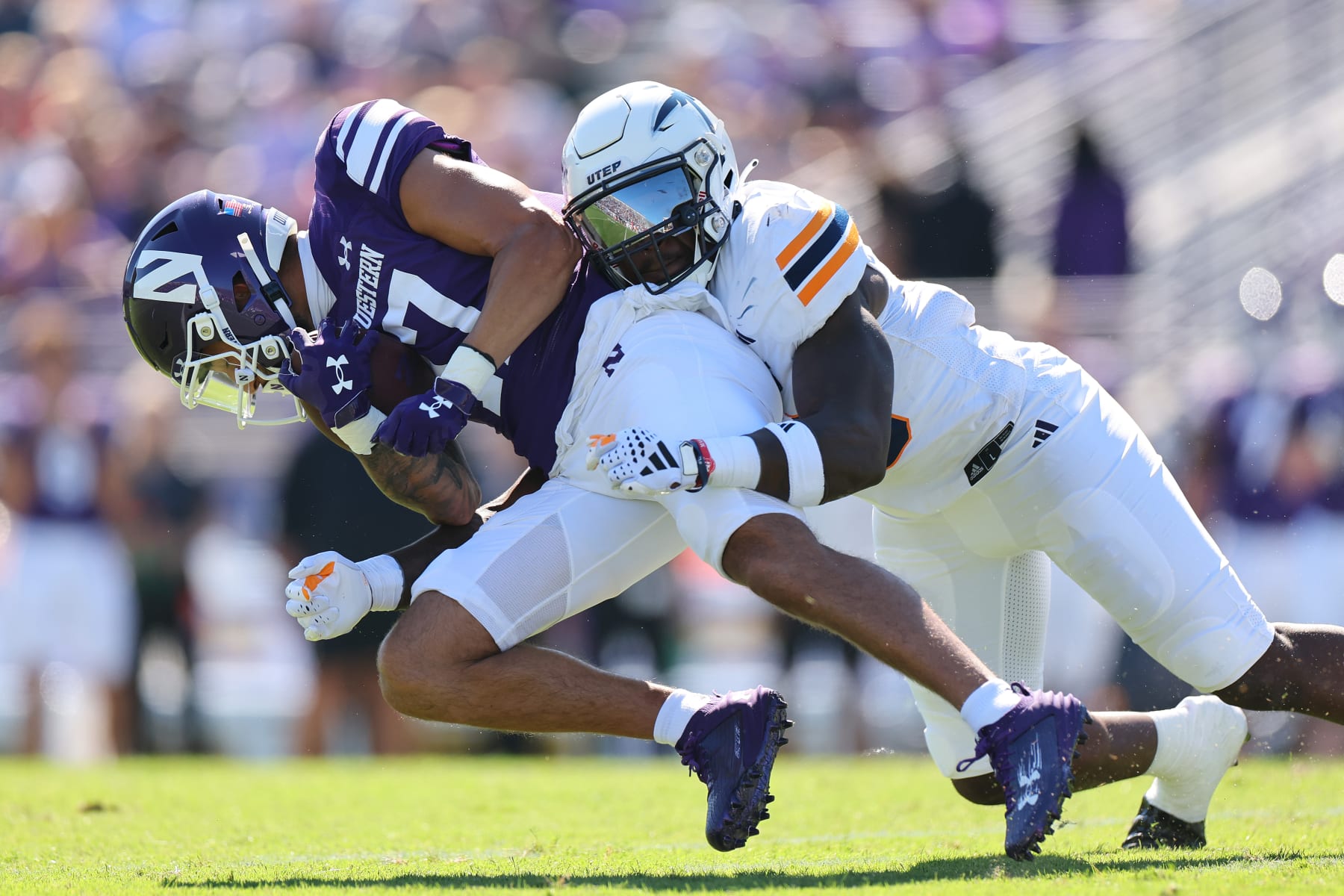 EVANSTON, ILLINOIS - SEPTEMBER 09: Tyrice Knight #10 of the UTEP Miners tackles Bryce Kirtz #17 of the Northwestern Wildcats during the first half at Ryan Field on September 09, 2023 in Evanston, Illinois. (Photo by Michael Reaves/Getty Images)