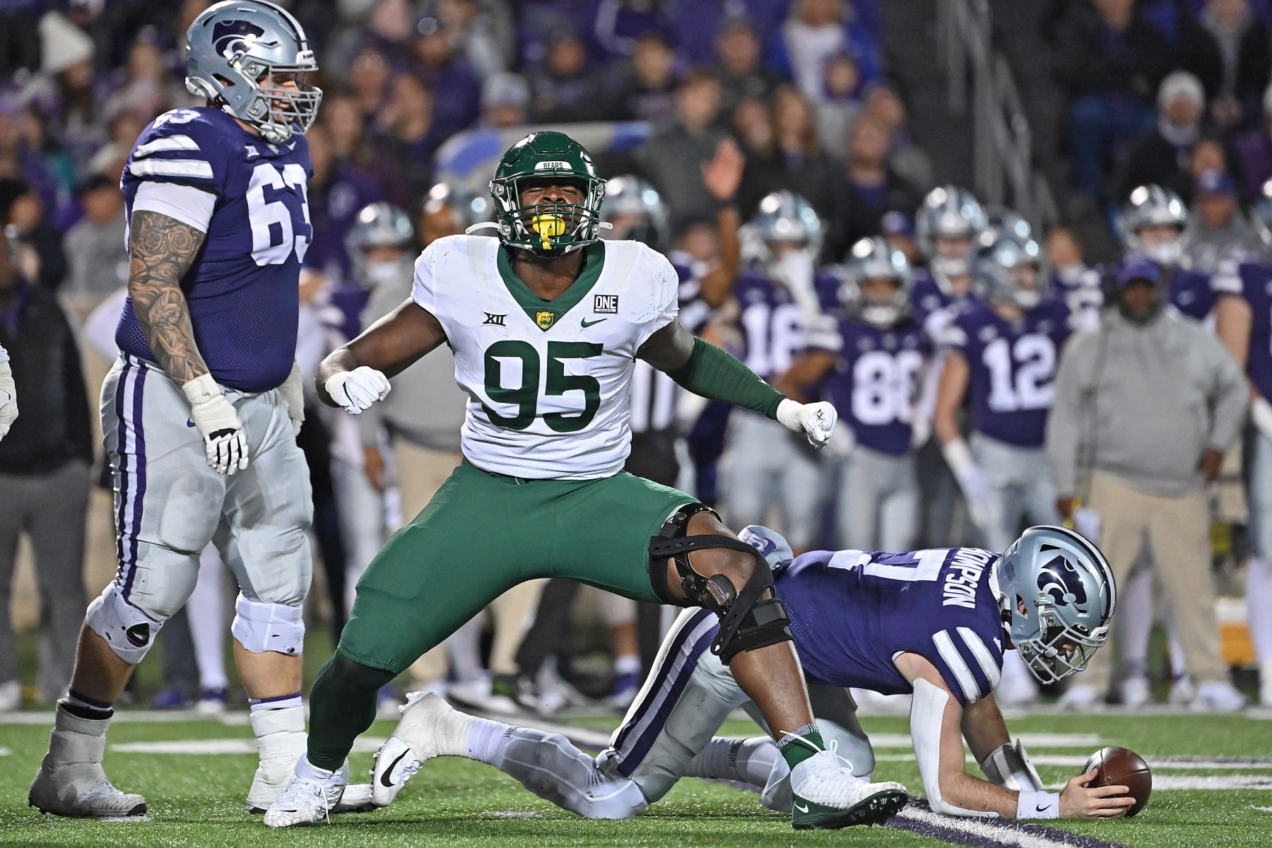 MANHATTAN, KS - NOVEMBER 20:  Defensive lineman Gabe Hall #95 of the Baylor Bears celebrates after sacking quarterback Skylar Thompson #7 of the Kansas State Wildcats, during the second half at Bill Snyder Family Football Stadium on November 20, 2021 in Manhattan, Kansas. (Photo by Peter Aiken/Getty Images)