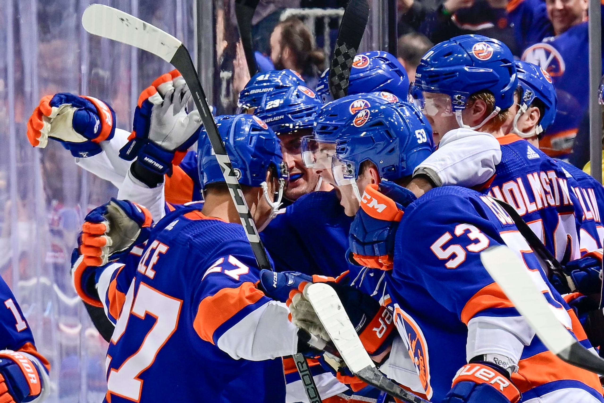 ELMONT, NEW YORK - APRIL 09: Anders Lee #27 of the New York Islanders is congratulated by his teammates after scoring an empty-net goal against the New York Rangers during the third period at UBS Arena on April 09, 2024 in Elmont, New York. (Photo by Steven Ryan/NHLI via Getty Images) ELMONT, NEW YORK - APRIL 09: Anders Lee #27 of the New York Islanders is congratulated by his teammates after scoring an empty-net goal against the New York Rangers during the third period at UBS Arena on April 09, 2024 in Elmont, New York. (Photo by Steven Ryan/NHLI via Getty Images)
