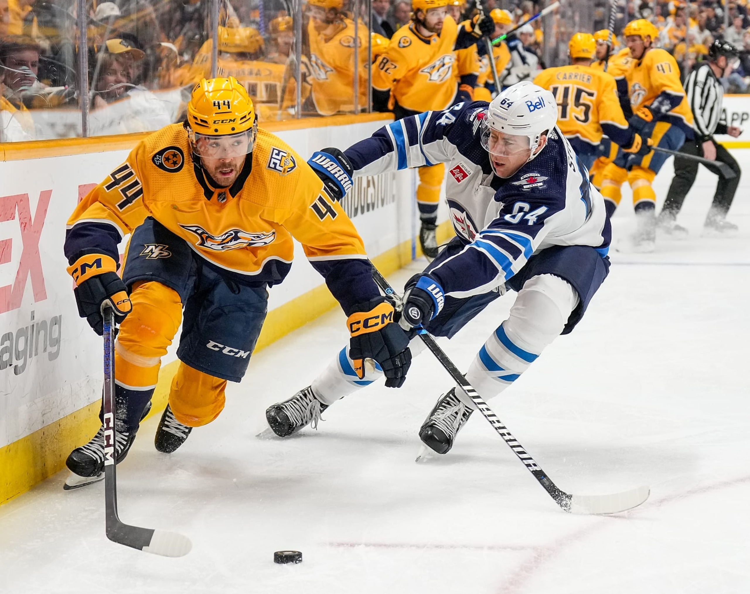 NASHVILLE, TENNESSEE - APRIL 9: Kiefer Sherwood #44 of the Nashville Predators skates against Logan Stanley #64 of the Winnipeg Jets during an NHL game at Bridgestone Arena on April 9, 2024 in Nashville, Tennessee. (Photo by John Russell/NHLI via Getty Images) NASHVILLE, TENNESSEE - APRIL 9: Kiefer Sherwood #44 of the Nashville Predators skates against Logan Stanley #64 of the Winnipeg Jets during an NHL game at Bridgestone Arena on April 9, 2024 in Nashville, Tennessee. (Photo by John Russell/NHLI via Getty Images)