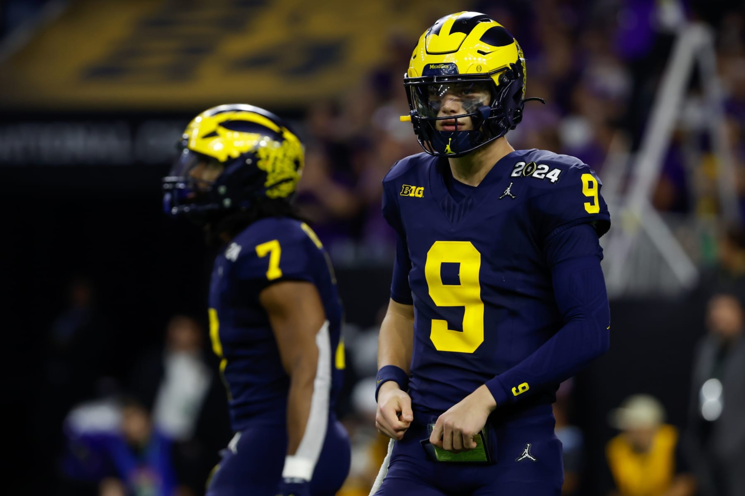 HOUSTON, TX - JANUARY 08: Michigan Wolverines quarterback J.J. McCarthy (9) looks to the sidelines for a play during the CFP National Championship game Michigan Wolverines and Washington Huskies on January 8, 2024, at NRG Stadium in Houston, Texas. (Photo by David Buono/Icon Sportswire via Getty Images) HOUSTON, TX - JANUARY 08: Michigan Wolverines quarterback J.J. McCarthy (9) looks to the sidelines for a play during the CFP National Championship game Michigan Wolverines and Washington Huskies on January 8, 2024, at NRG Stadium in Houston, Texas. (Photo by David Buono/Icon Sportswire via Getty Images)