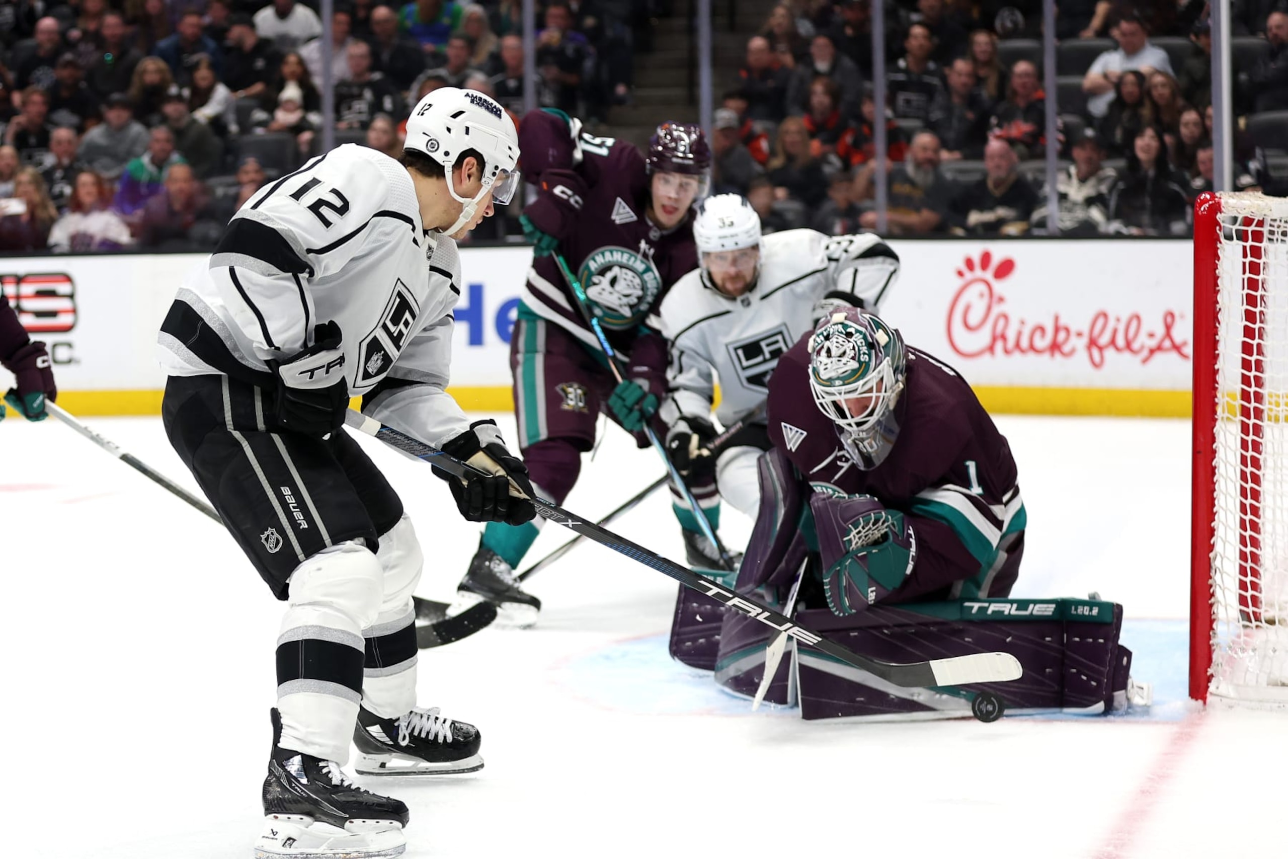ANAHEIM, CALIFORNIA - APRIL 09: Lukas Dostal #1 of the Anaheim Ducks blocks a shot on goal by Trevor Moore #12 of the Los Angeles Kings during the third period of a game at Honda Center on April 09, 2024 in Anaheim, California. (Photo by Sean M. Haffey/Getty Images) ANAHEIM, CALIFORNIA - APRIL 09: Lukas Dostal #1 of the Anaheim Ducks blocks a shot on goal by Trevor Moore #12 of the Los Angeles Kings during the third period of a game at Honda Center on April 09, 2024 in Anaheim, California. (Photo by Sean M. Haffey/Getty Images)