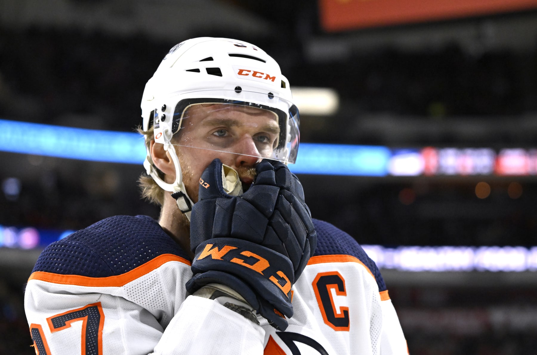 RALEIGH, NORTH CAROLINA - FEBRUARY 27: Connor McDavid #97 of the Edmonton Oilers leaves the ice with an injury during the first period of their game against the Carolina Hurricanes at PNC Arena on February 27, 2022 in Raleigh, North Carolina. (Photo by Grant Halverson/Getty Images)