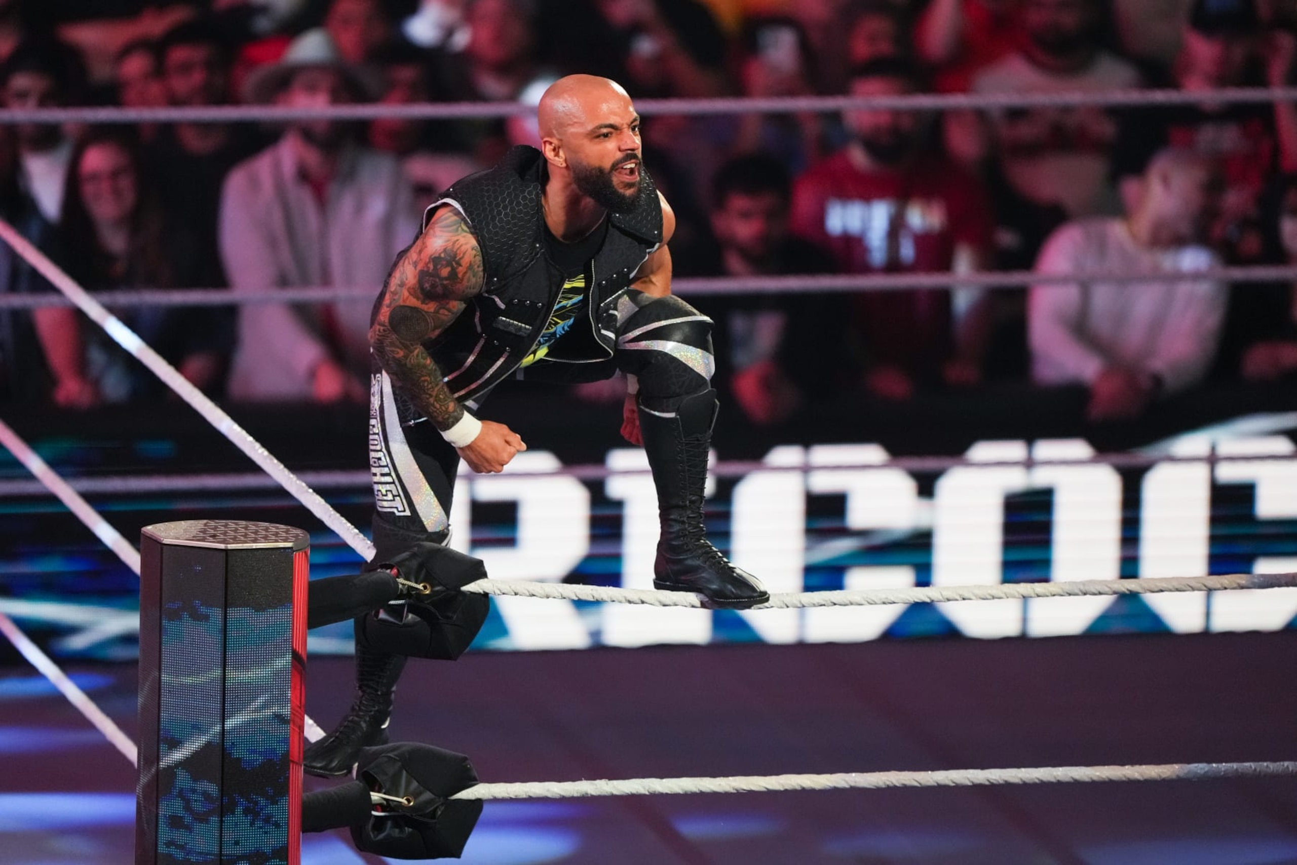 HOUSTON, TEXAS - MARCH 11: Ricochet is introduced prior to his match during WWE Monday Night RAW at Toyota Center on March 11, 2024 in Houston, Texas. (Photo by Alex Bierens de Haan/Getty Images)