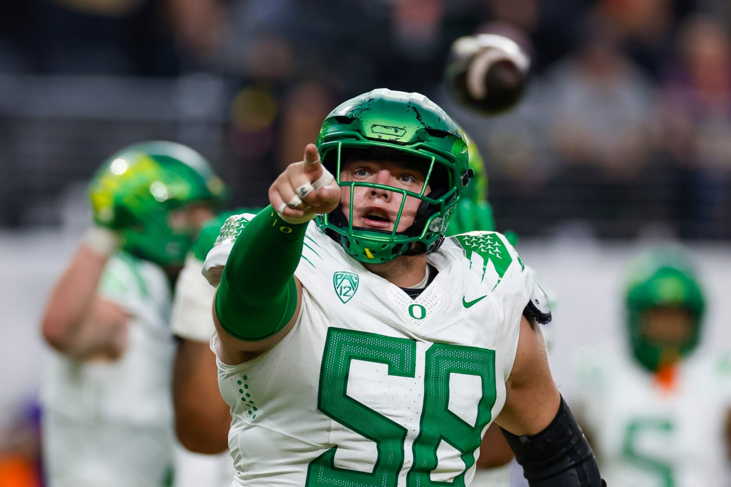 LAS VEGAS, NEVADA - DECEMBER 1: Jackson Powers-Johnson #58 of the Oregon Ducks reacts during the Pac-12 Championship game against the Washington Huskies at Allegiant Stadium on December 1, 2023 in Las Vegas, Nevada. (Photo by Brandon Sloter/Image Of Sport/Getty Images) LAS VEGAS, NEVADA - DECEMBER 1: Jackson Powers-Johnson #58 of the Oregon Ducks reacts during the Pac-12 Championship game against the Washington Huskies at Allegiant Stadium on December 1, 2023 in Las Vegas, Nevada. (Photo by Brandon Sloter/Image Of Sport/Getty Images)