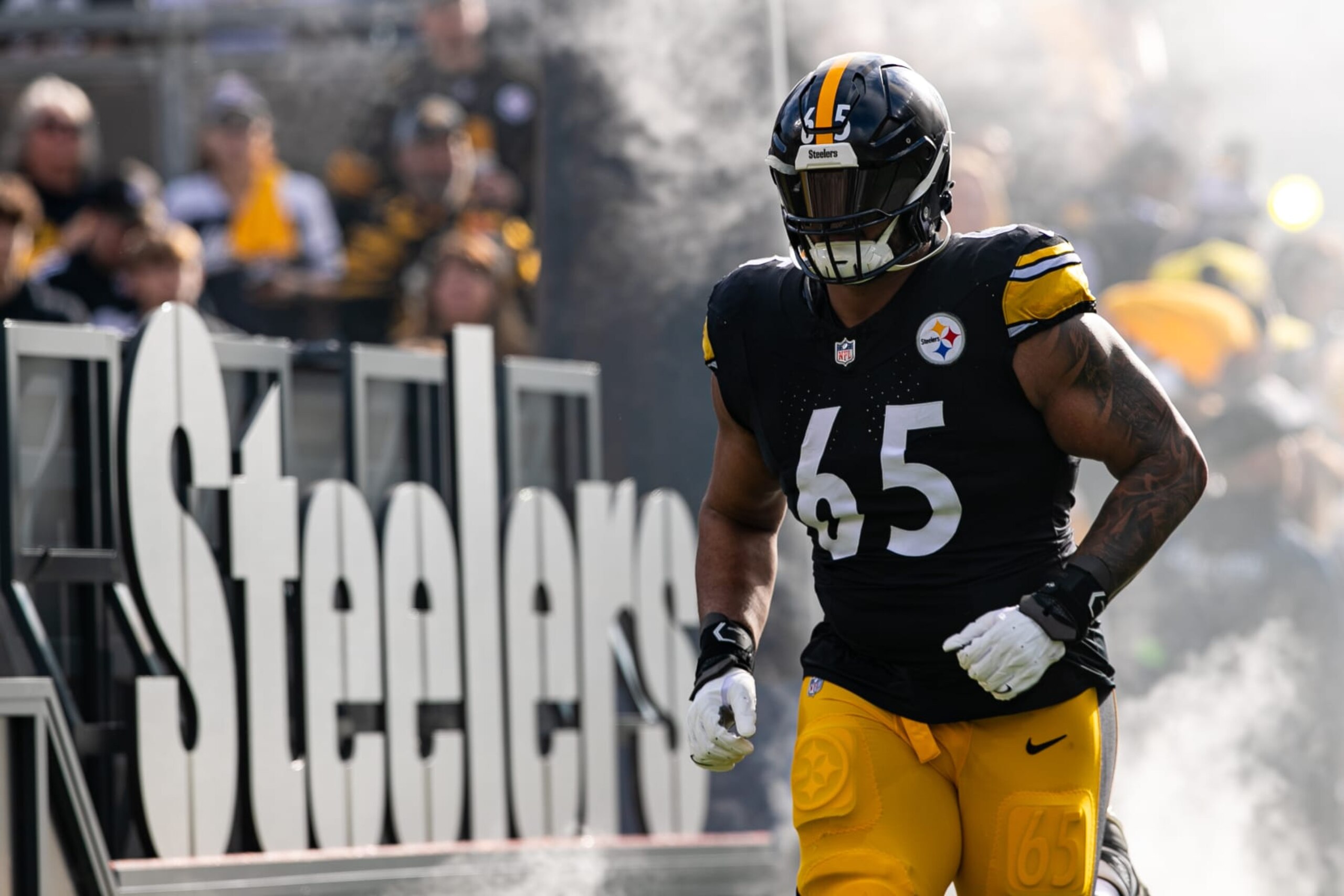 PITTSBURGH, PA - DECEMBER 03: Pittsburgh Steelers offensive tackle Dan Moore Jr. (65) runs onto the field during the regular season NFL football game between the Arizona Cardinals and the Pittsburgh Steelers on December 03, 2023 at Acrisure Stadium in Pittsburgh, PA. (Photo by Mark Alberti/Icon Sportswire via Getty Images)