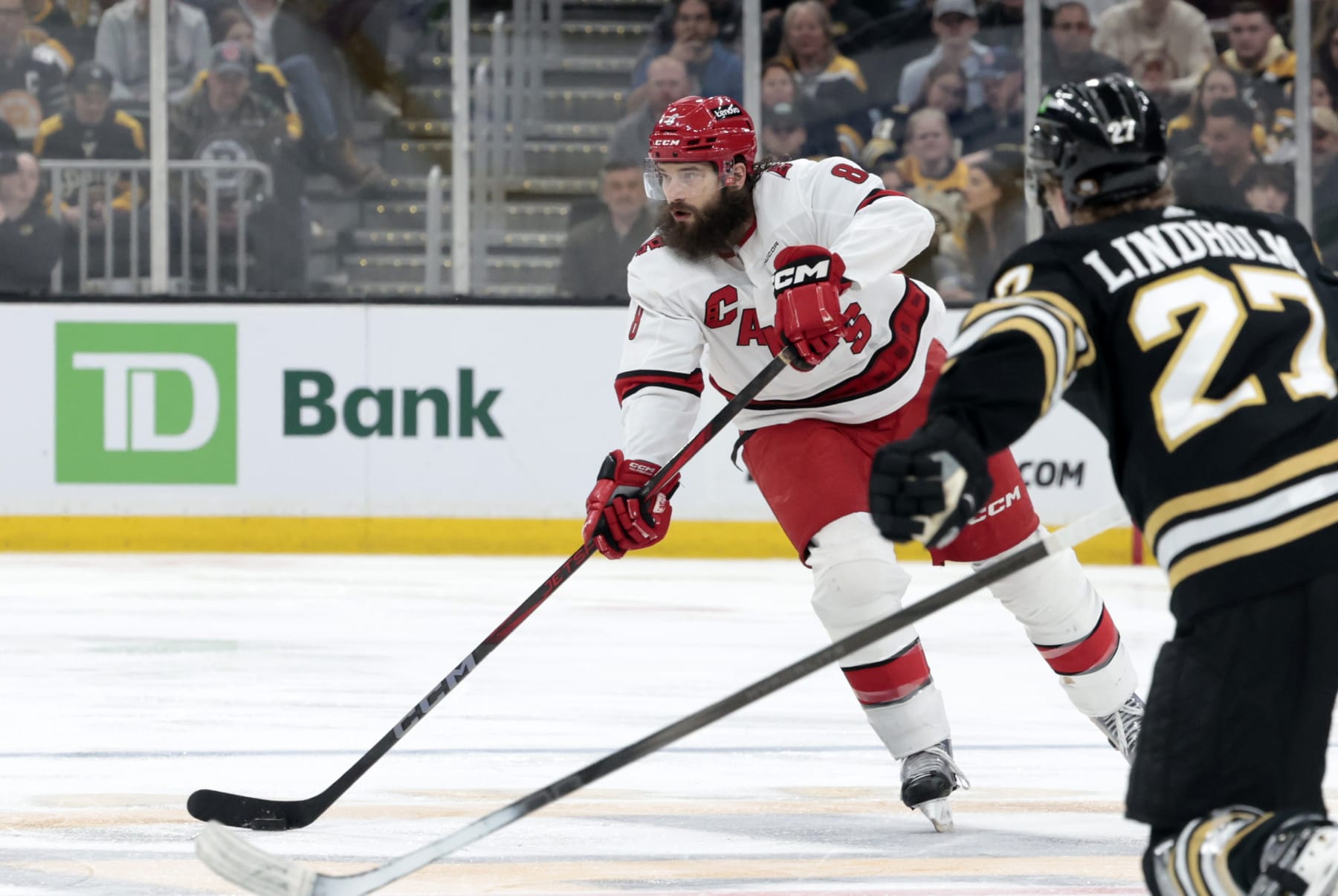 BOSTON, MA - APRIL 09: Carolina Hurricanes defenseman Brent Burns (8) plays the puck wide during a game between the Boston Bruins and the Carolina Hurricanes on April 9, 2024, at TD Garden in Boston, Massachusetts. (Photo by Fred Kfoury III/Icon Sportswire via Getty Images)