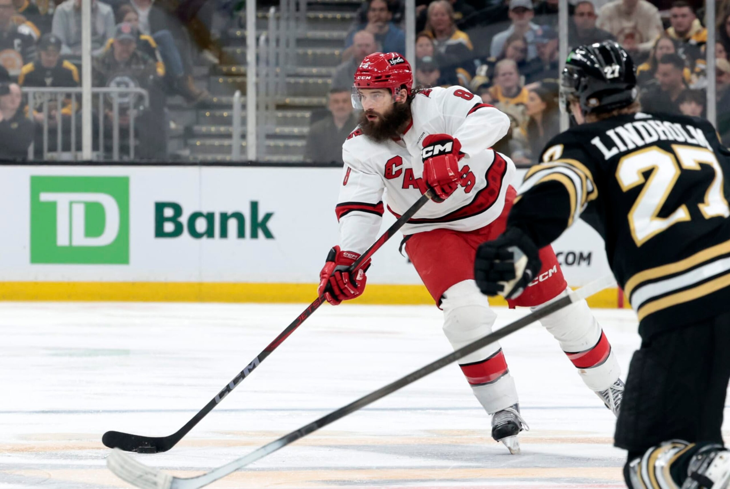 BOSTON, MA - APRIL 09: Carolina Hurricanes defenseman Brent Burns (8) plays the puck wide during a game between the Boston Bruins and the Carolina Hurricanes on April 9, 2024, at TD Garden in Boston, Massachusetts. (Photo by Fred Kfoury III/Icon Sportswire via Getty Images)