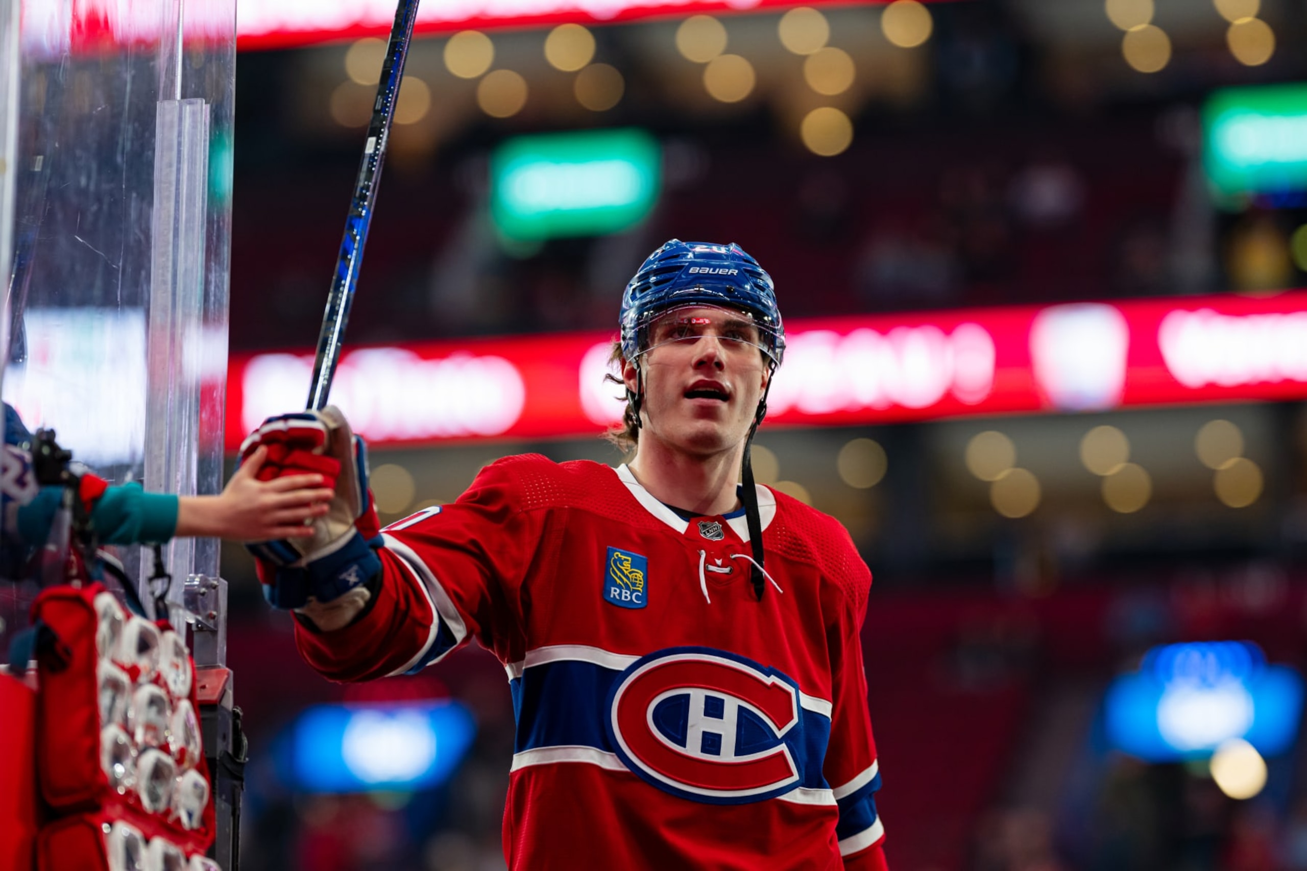 MONTREAL, CANADA - APRIL 9: Juraj Slafkovsky #20 of the Montreal Canadiens fist-bumps a fan during the warm-up of NHL regular season game between the Montreal Canadiens and the Philadelphia Flyers at the Bell Centre on April 9, 2024 in Montreal, Quebec, Canada. (Photo by Matt Garies/NHLI via Getty Images) MONTREAL, CANADA - APRIL 9: Juraj Slafkovsky #20 of the Montreal Canadiens fist-bumps a fan during the warm-up of NHL regular season game between the Montreal Canadiens and the Philadelphia Flyers at the Bell Centre on April 9, 2024 in Montreal, Quebec, Canada. (Photo by Matt Garies/NHLI via Getty Images)