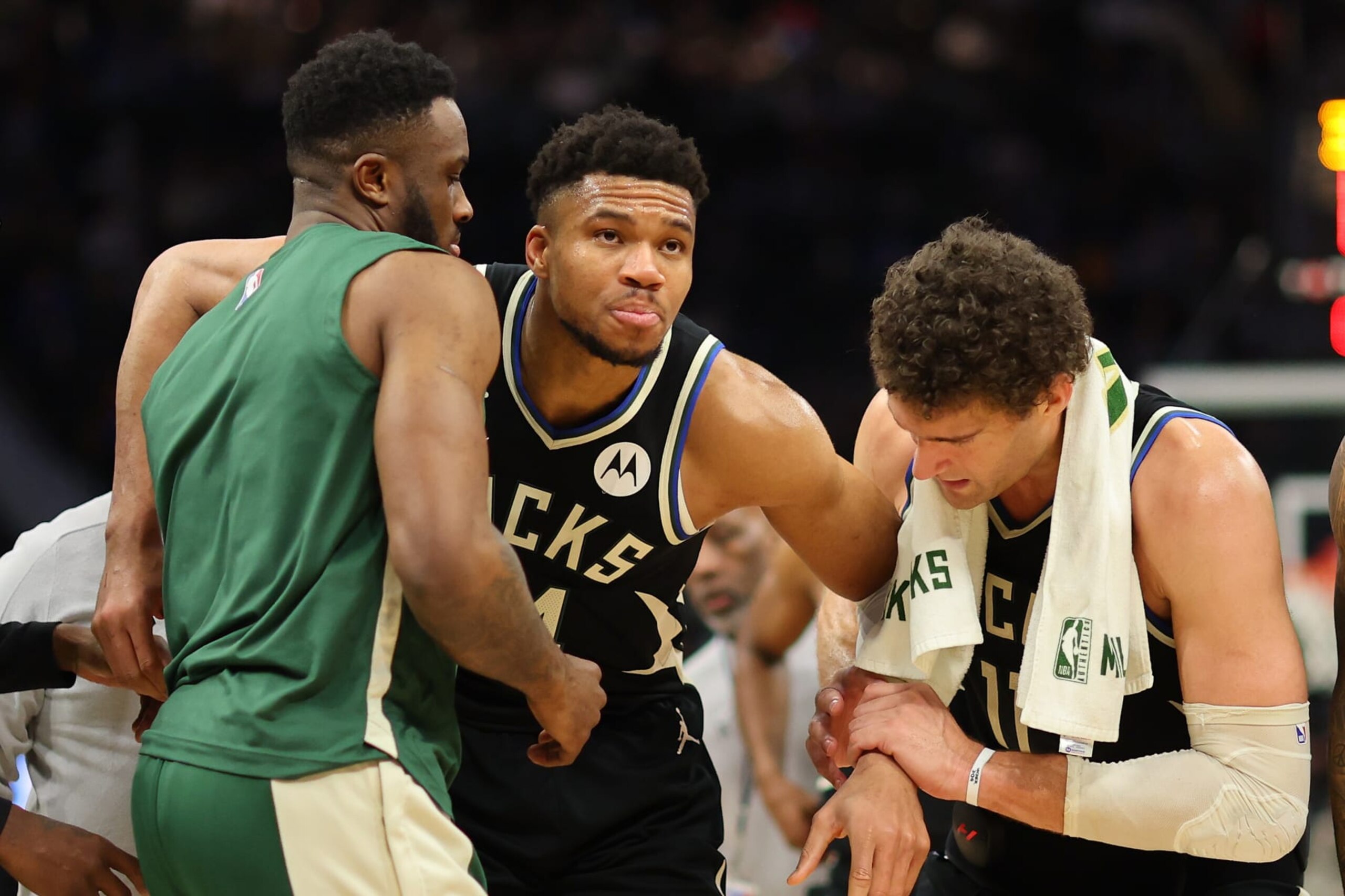 MILWAUKEE, WISCONSIN - APRIL 09: Giannis Antetokounmpo #34 of the Milwaukee Bucks is helped off the court by Thanasis Antetokounmpo #43 and Brook Lopez #11 after suffering an injury during the second half of a game against the Boston Celtics at Fiserv Forum on April 09, 2024 in Milwaukee, Wisconsin. NOTE TO USER: User expressly acknowledges and agrees that, by downloading and or using this photograph, User is consenting to the terms and conditions of the Getty Images License Agreement. (Photo by Stacy Revere/Getty Images) MILWAUKEE, WISCONSIN - APRIL 09: Giannis Antetokounmpo #34 of the Milwaukee Bucks is helped off the court by Thanasis Antetokounmpo #43 and Brook Lopez #11 after suffering an injury during the second half of a game against the Boston Celtics at Fiserv Forum on April 09, 2024 in Milwaukee, Wisconsin. NOTE TO USER: User expressly acknowledges and agrees that, by downloading and or using this photograph, User is consenting to the terms and conditions of the Getty Images License Agreement. (Photo by Stacy Revere/Getty Images)