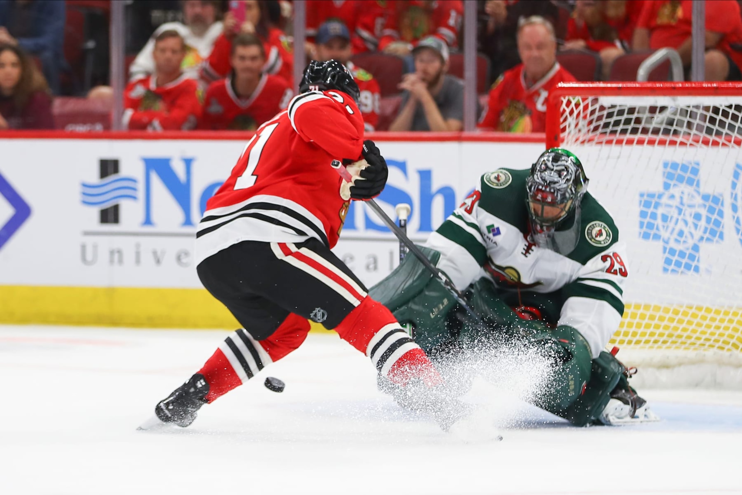 CHICAGO, IL - OCTOBER 05: Minnesota Wild goaltender Marc-Andre Fleury (29) makes a save against Chicago Blackhawks left wing Taylor Hall (71) during a shootout during a game between the Minnesota Wild and the Chicago Blackhawks on October 5, 2023 at the United Center in Chicago, IL. (Photo by Melissa Tamez/Icon Sportswire via Getty Images) CHICAGO, IL - OCTOBER 05: Minnesota Wild goaltender Marc-Andre Fleury (29) makes a save against Chicago Blackhawks left wing Taylor Hall (71) during a shootout during a game between the Minnesota Wild and the Chicago Blackhawks on October 5, 2023 at the United Center in Chicago, IL. (Photo by Melissa Tamez/Icon Sportswire via Getty Images)