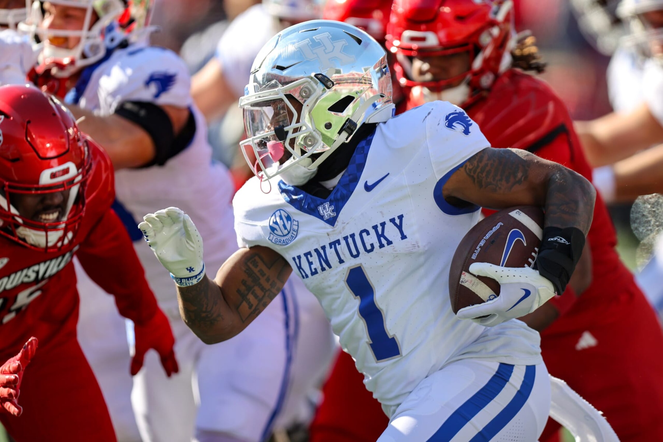 LOUISVILLE, KY - NOVEMBER 25: Kentucky Wildcats running back Ray Davis (1) carries the football during the first quarter of the college football game between the Kentucky Wildcats and Louisville Cardinals on November 25, 2023, at L&N Federal Credit Union Stadium in Louisville, KY. (Photo by Frank Jansky/Icon Sportswire via Getty Images) LOUISVILLE, KY - NOVEMBER 25: Kentucky Wildcats running back Ray Davis (1) carries the football during the first quarter of the college football game between the Kentucky Wildcats and Louisville Cardinals on November 25, 2023, at L&N Federal Credit Union Stadium in Louisville, KY. (Photo by Frank Jansky/Icon Sportswire via Getty Images)