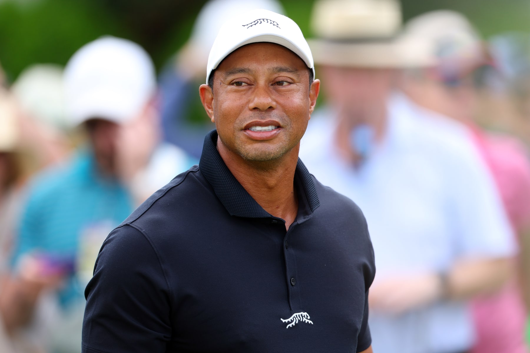 AUGUSTA, GEORGIA - APRIL 10: Tiger Woods of the United States looks on from the putting green during a practice round prior to the 2024 Masters Tournament at Augusta National Golf Club on April 10, 2024 in Augusta, Georgia. (Photo by Andrew Redington/Getty Images)