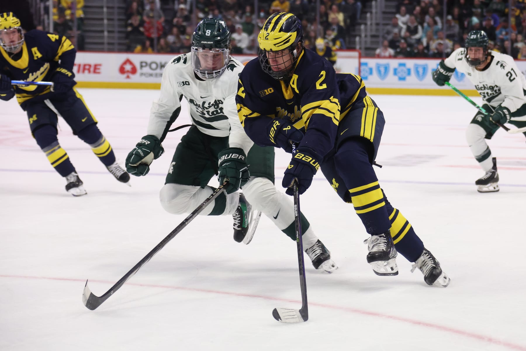 DETROIT, MICHIGAN - FEBRUARY 10: Rutger McGroarty #2 of the Michigan Wolverines tries to get around Maxim Štrbák #8 of the Michigan St. Spartans during the first period at Little Caesars Arena on February 10, 2024 in Detroit, Michigan. (Photo by Gregory Shamus/Getty Images)
