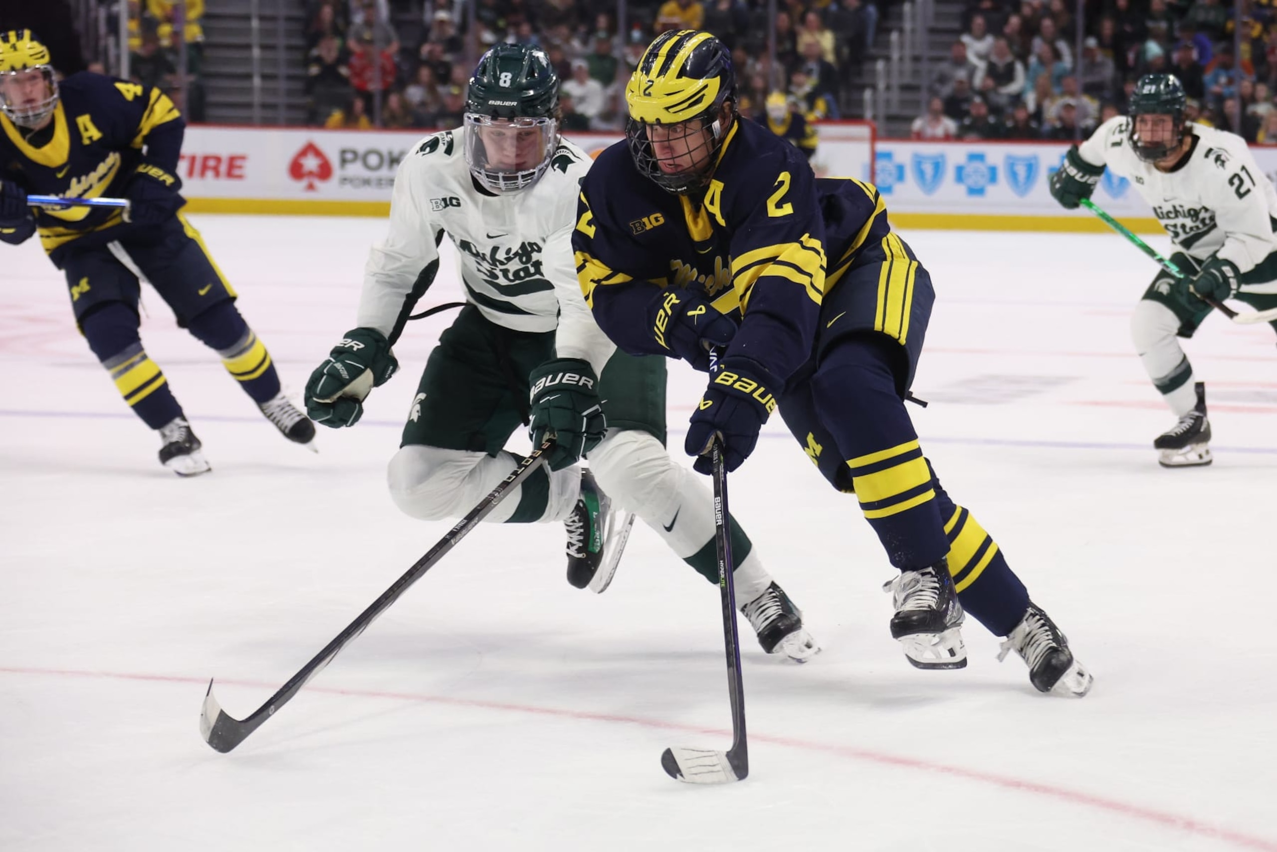 DETROIT, MICHIGAN - FEBRUARY 10: Rutger McGroarty #2 of the Michigan Wolverines tries to get around Maxim Štrbák #8 of the Michigan St. Spartans during the first period at Little Caesars Arena on February 10, 2024 in Detroit, Michigan. (Photo by Gregory Shamus/Getty Images)