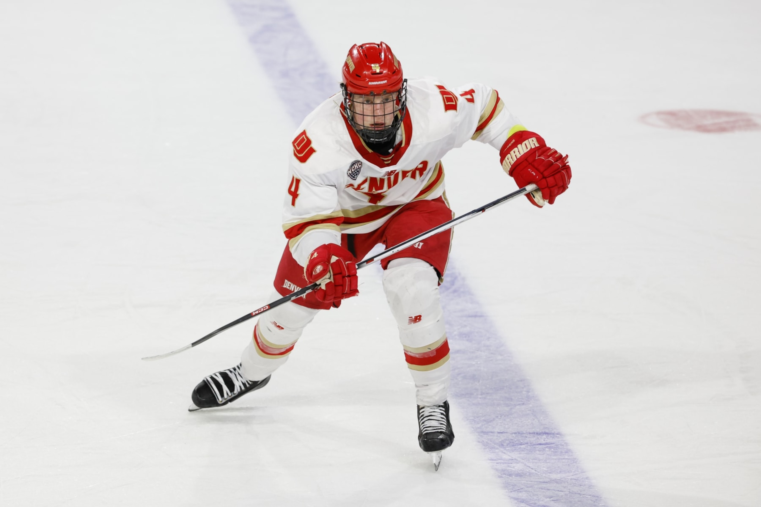 SPRINGFIELD, MASSACHUSETTS - MARCH 30: Jack Devine #4 of the Denver Pioneers skates against the Cornell Big Red during the NCAA Division I Men's Ice Hockey Regional Championship final at the MassMutual Center on March 30, 2024 in Springfield, Massachusetts. The Pioneers won 2-1 to advance to the Frozen Four in St. Paul, Minnesota. (Photo by Richard T Gagnon/Getty Images)