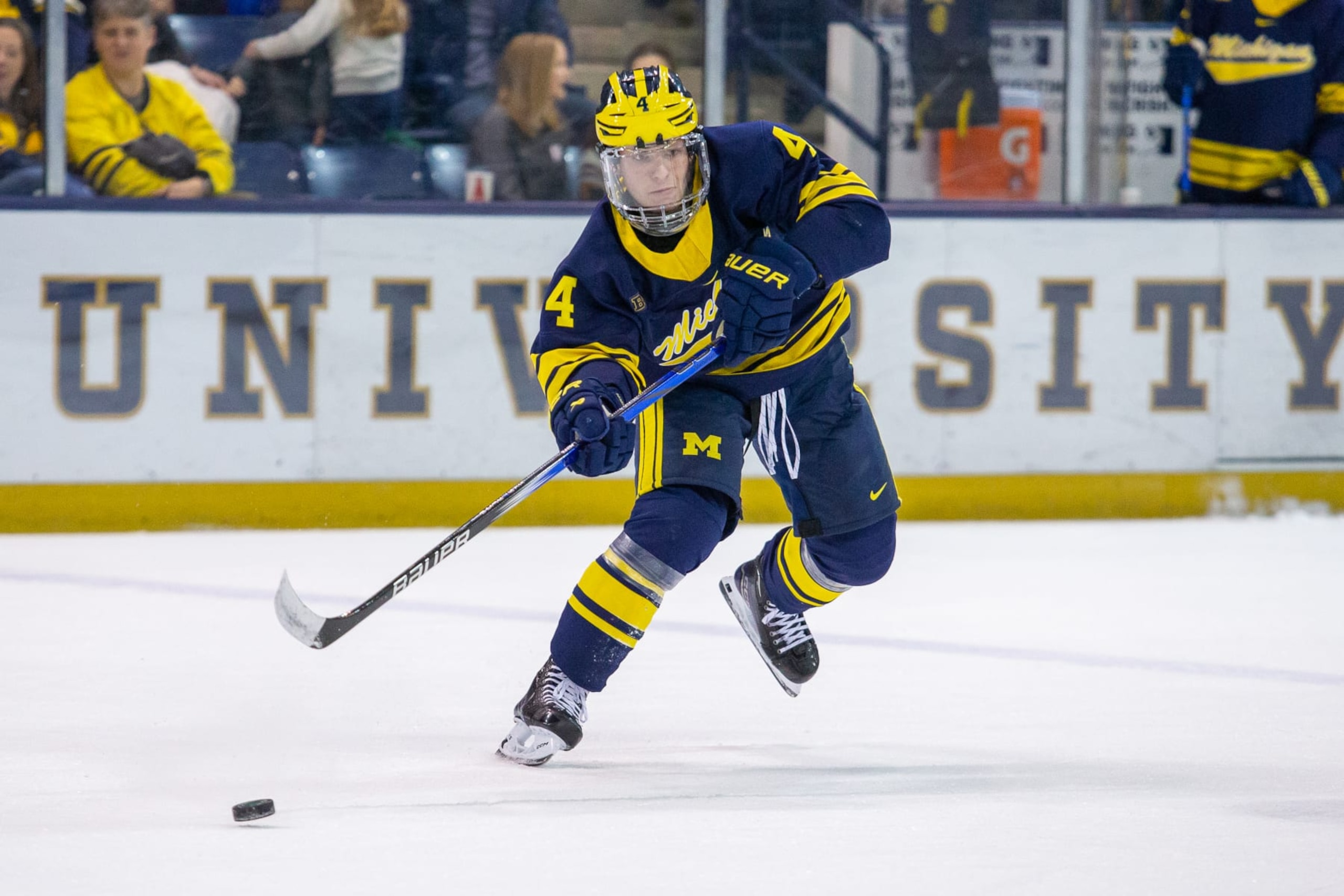 SOUTH BEND, IN - DECEMBER 1: Gavin Brindley #4 of Michigan makes a pass during a game between University of Michigan and University of Notre Dame at Compton Family Ice Arena on December 1, 2023 in South Bend, Indiana. (Photo by Michael Miller/ISI Photos/Getty Images)