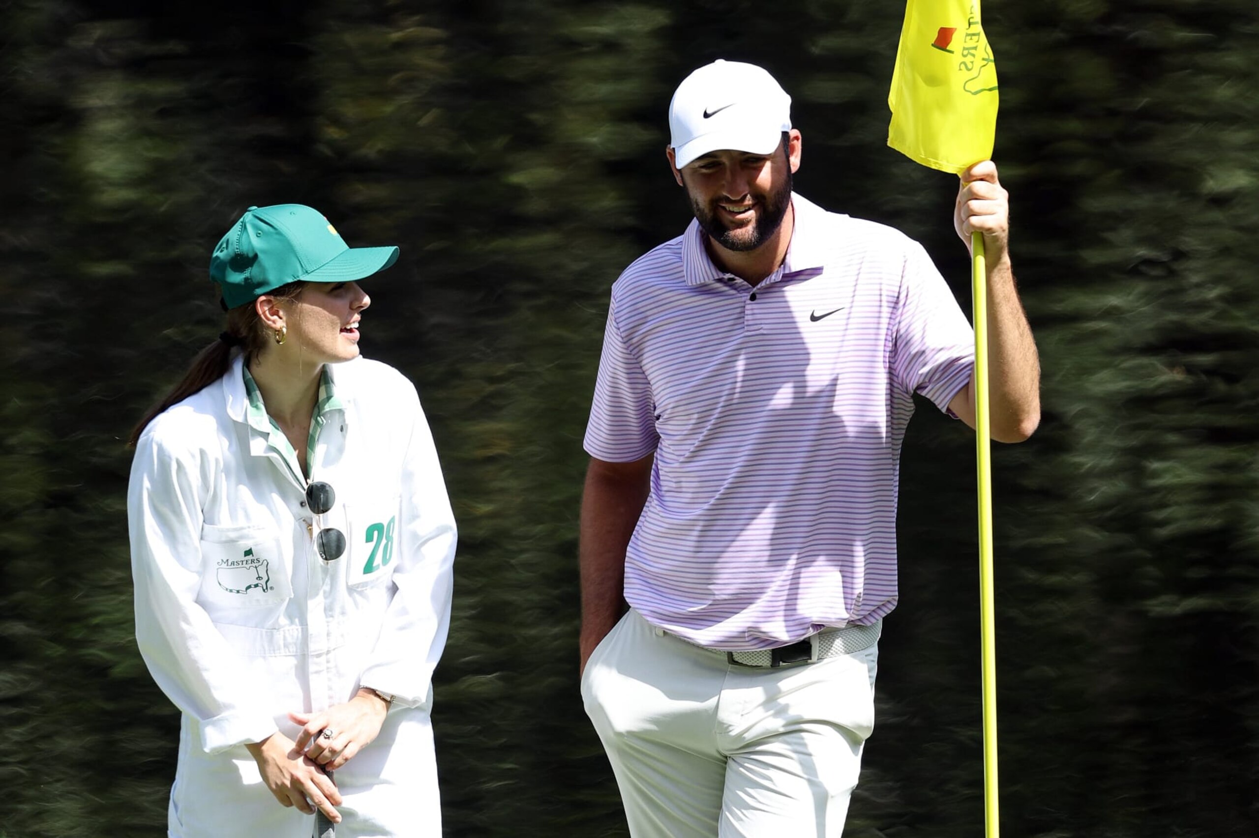 AUGUSTA, GEORGIA - APRIL 10: Scottie Scheffler of the United States looks on with his sister on the ninth green during the Par Three Contest prior to the 2024 Masters Tournament at Augusta National Golf Club on April 10, 2024 in Augusta, Georgia. (Photo by Warren Little/Getty Images)