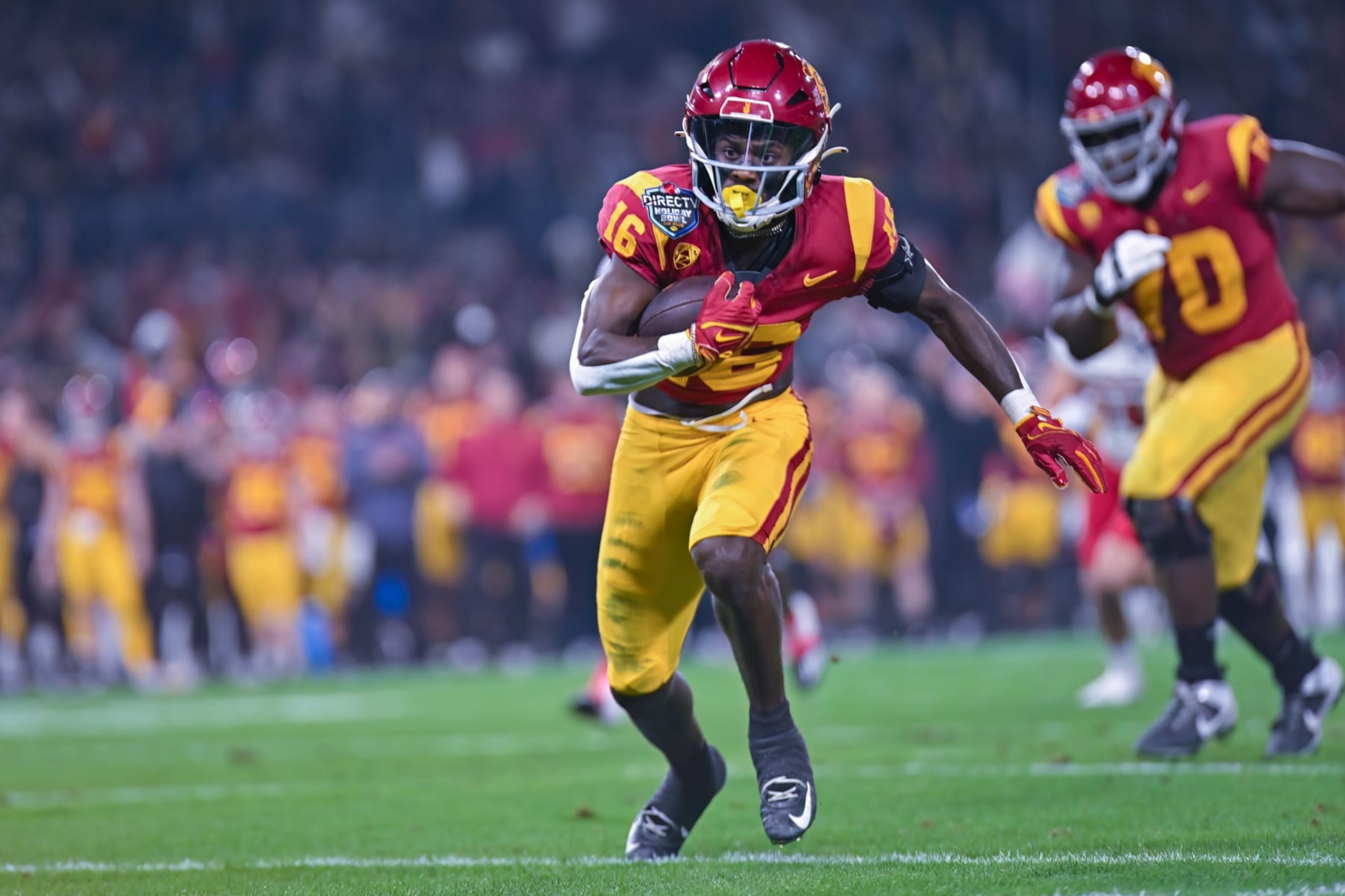 SAN DIEGO, CA - DECEMBER 27: USC Trojans wide receiver Tahj Washington (16) runs with the ball after a catch during the DIRECTV Holiday Bowl football game between the Louisville Cardinals and the USC Trojans on December 27th, 2023, at Petco Park in San Diego, CA. (Photo by Justin Fine/Icon Sportswire via Getty Images) SAN DIEGO, CA - DECEMBER 27: USC Trojans wide receiver Tahj Washington (16) runs with the ball after a catch during the DIRECTV Holiday Bowl football game between the Louisville Cardinals and the USC Trojans on December 27th, 2023, at Petco Park in San Diego, CA. (Photo by Justin Fine/Icon Sportswire via Getty Images)
