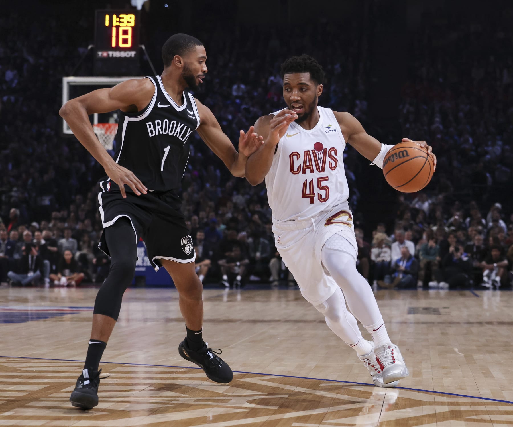 PARIS, FRANCE - JANUARY 11: Donovan Mitchell #45 of the Cleveland Cavaliers moves the ball against Mikal Bridges #1 of the Brooklyn Nets as part of NBA Paris Games 2024 on January 11, 2024 at Accor Arena in Paris, France. NOTE TO USER: User expressly acknowledges and agrees that, by downloading and/or using this photograph, User is consenting to the terms and conditions of the Getty Images License Agreement. Mandatory Copyright Notice: Copyright 2024 NBAE (Photo by Catherine Steenkeste/NBAE via Getty Images)