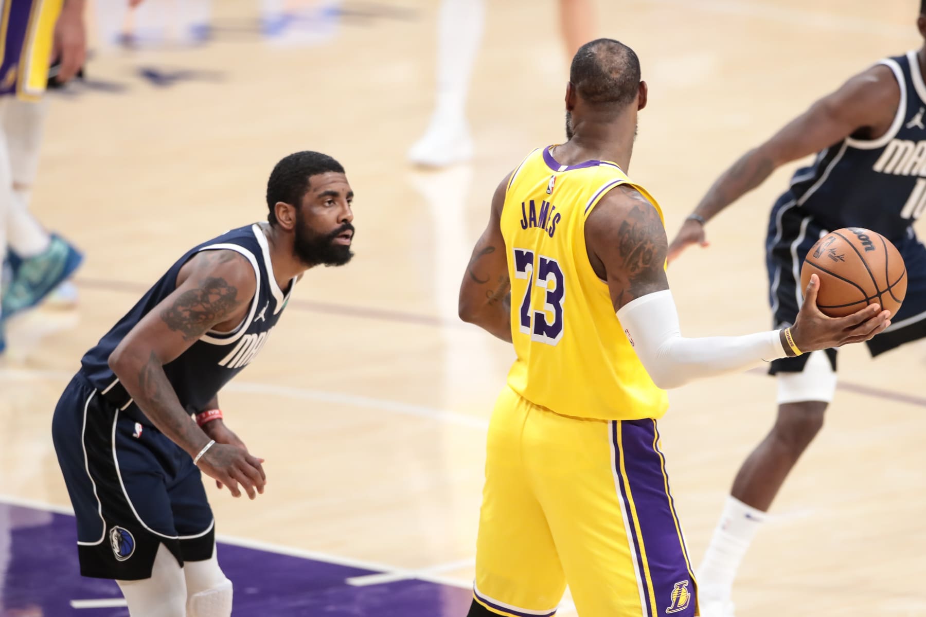 LOS ANGELES, CA - JANUARY 17: Los Angeles Lakers forward LeBron James (23) matched up with Dallas Mavericks guard Kyrie Irving (11) during the NBA game between the Dallas Mavericks and Los Angeles Lakers on January 17. 2024, at Crypto.com Arena in Los Angeles, CA.  (Photo by Jevone Moore/Icon Sportswire via Getty Images)