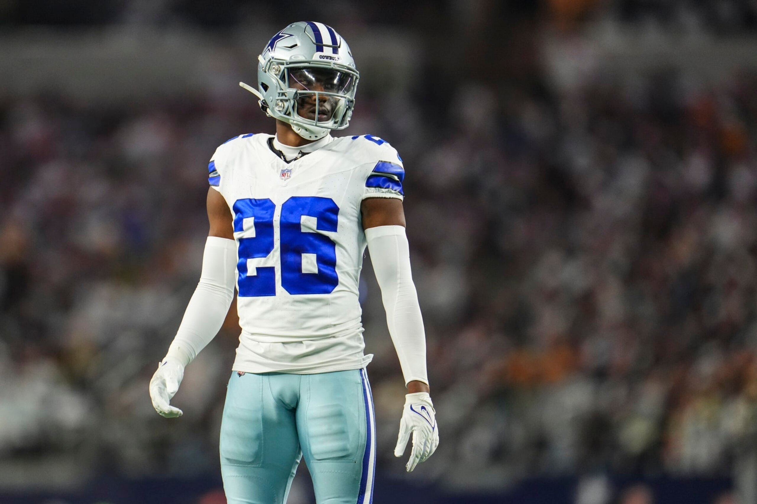 DALLAS, TX - JANUARY 14: DaRon Bland #26 of the Dallas Cowboys looks on from the field during an NFL wild-card playoff football game against the Green Bay Packers at AT&T Stadium on January 14, 2024 in Dallas, Texas. (Photo by Cooper Neill/Getty Images)