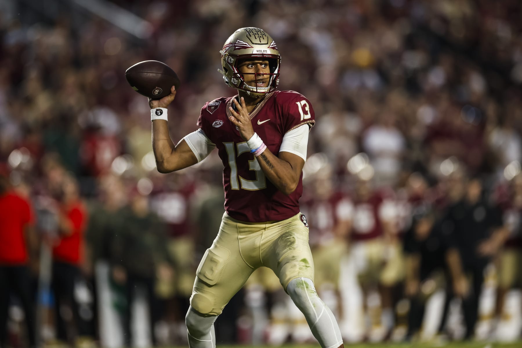 TALLAHASSEE, FLORIDA - NOVEMBER 11: Jordan Travis #13 of the Florida State Seminoles throws a pass during the second half of a game against the Miami Hurricanes at Doak Campbell Stadium on November 11, 2023 in Tallahassee, Florida. (Photo by James Gilbert/Getty Images)
