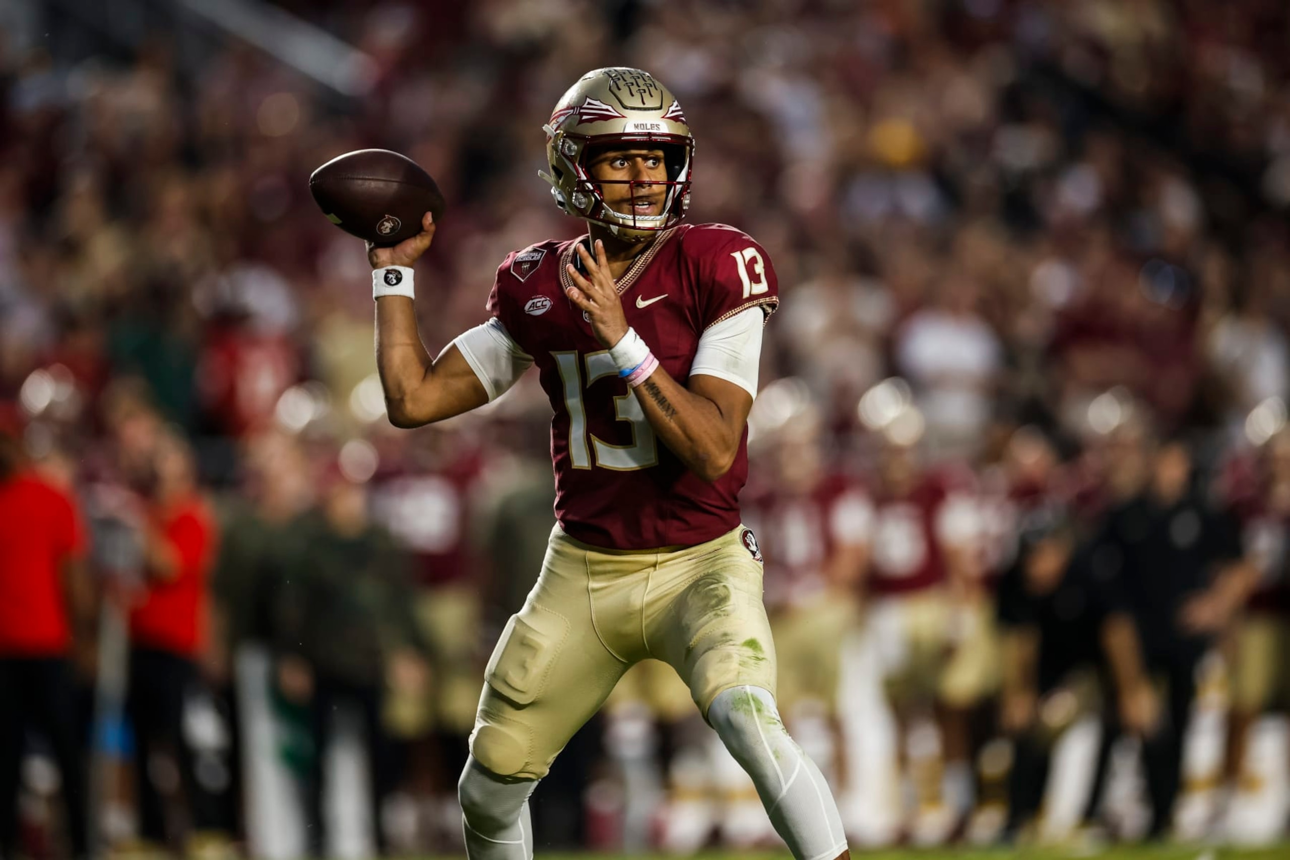 TALLAHASSEE, FLORIDA - NOVEMBER 11: Jordan Travis #13 of the Florida State Seminoles throws a pass during the second half of a game against the Miami Hurricanes at Doak Campbell Stadium on November 11, 2023 in Tallahassee, Florida. (Photo by James Gilbert/Getty Images)