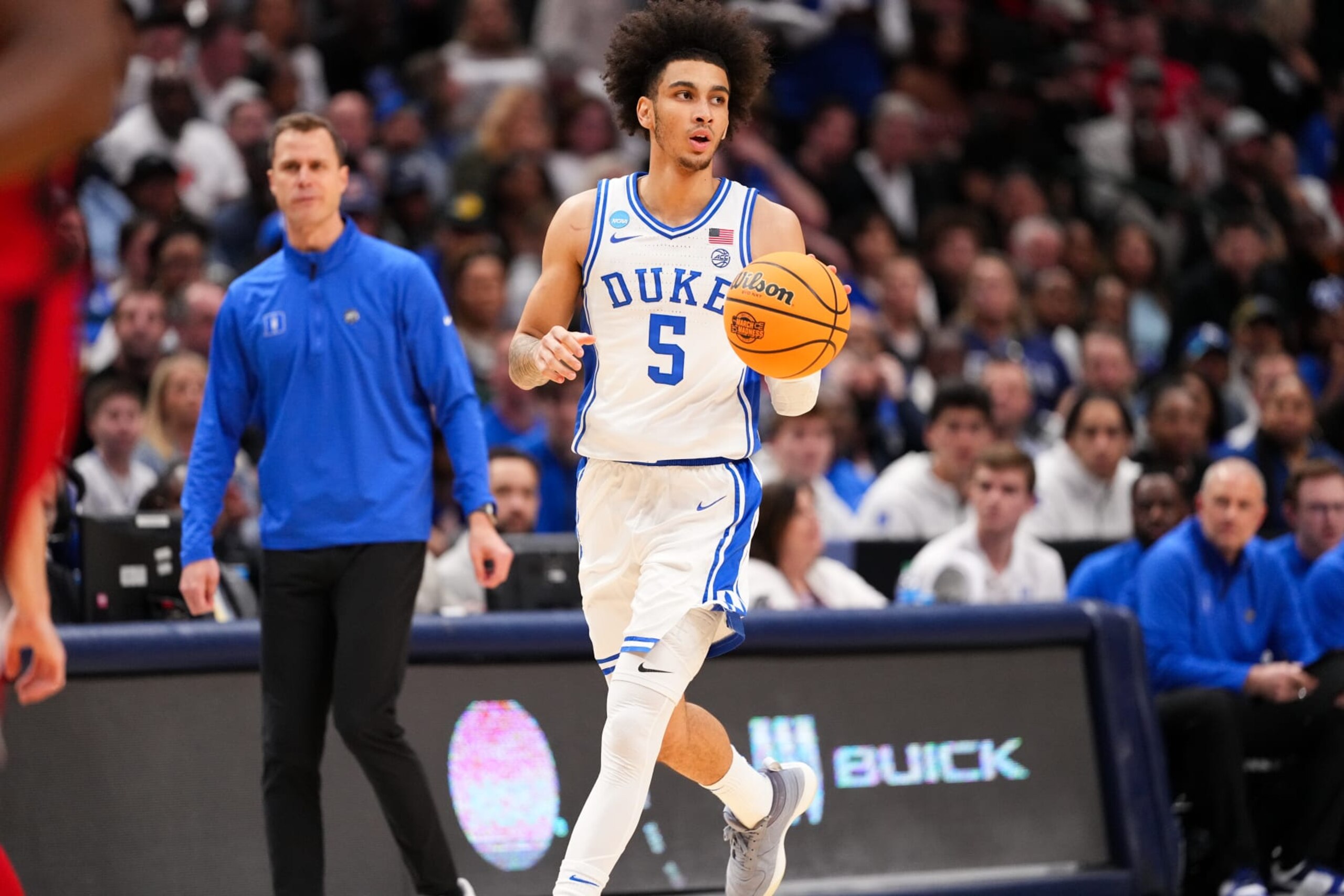 DALLAS, TEXAS - MARCH 31: Tyrese Proctor #5 of the Duke Blue Devils brings the ball up court in a game against the North Carolina State Wolfpack during the Elite Eight round of the 2024 NCAA Men's Basketball Tournament held at American Airlines Center on March 31, 2024 in Dallas, Texas. (Photo by Jack Dempsey/NCAA Photos via Getty Images) DALLAS, TEXAS - MARCH 31: Tyrese Proctor #5 of the Duke Blue Devils brings the ball up court in a game against the North Carolina State Wolfpack during the Elite Eight round of the 2024 NCAA Men's Basketball Tournament held at American Airlines Center on March 31, 2024 in Dallas, Texas. (Photo by Jack Dempsey/NCAA Photos via Getty Images)